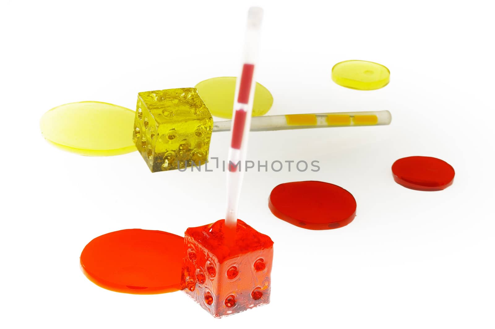 bounch of colorfull translucent dice shaped lollipops backlit on white background