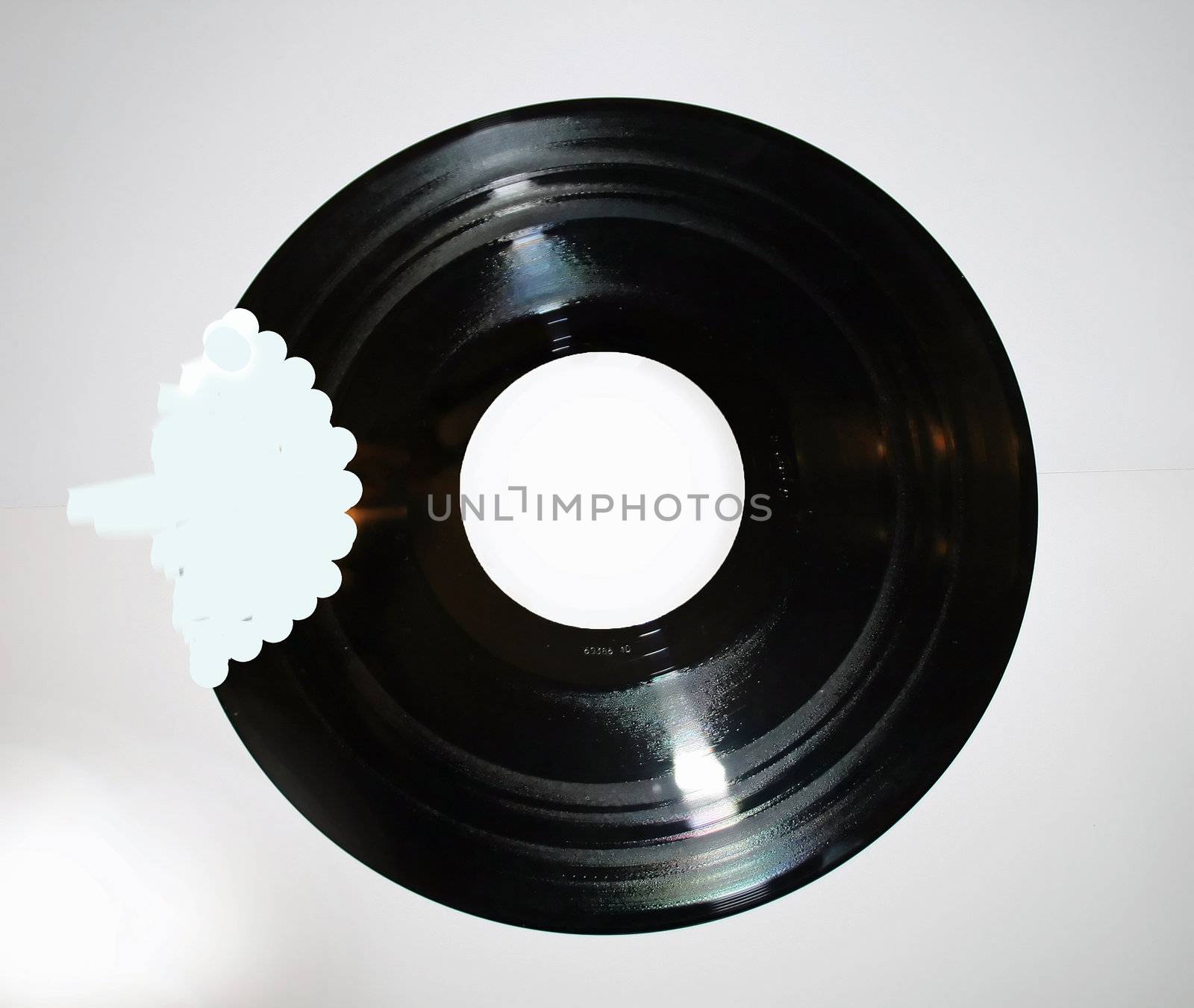 A vinyl record with mouth and teeth