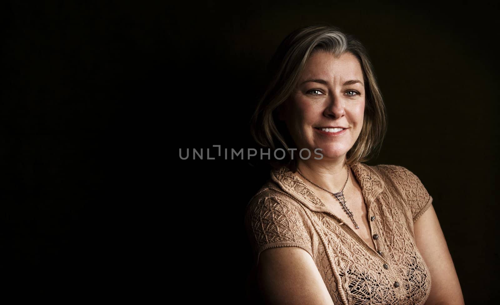 Portrait of pretty adult woman with blue eyes