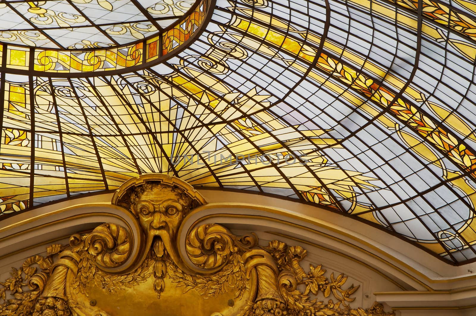 Gold colored stained glass windows as part of a domed cieling