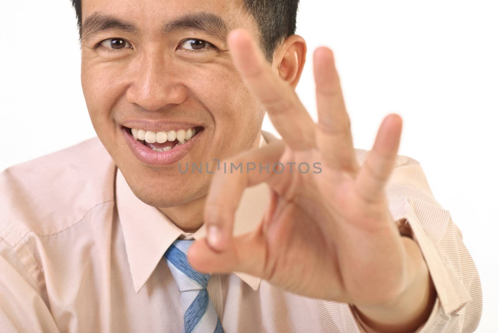 Manager show OK gesture with smiling expression, closeup portrait.