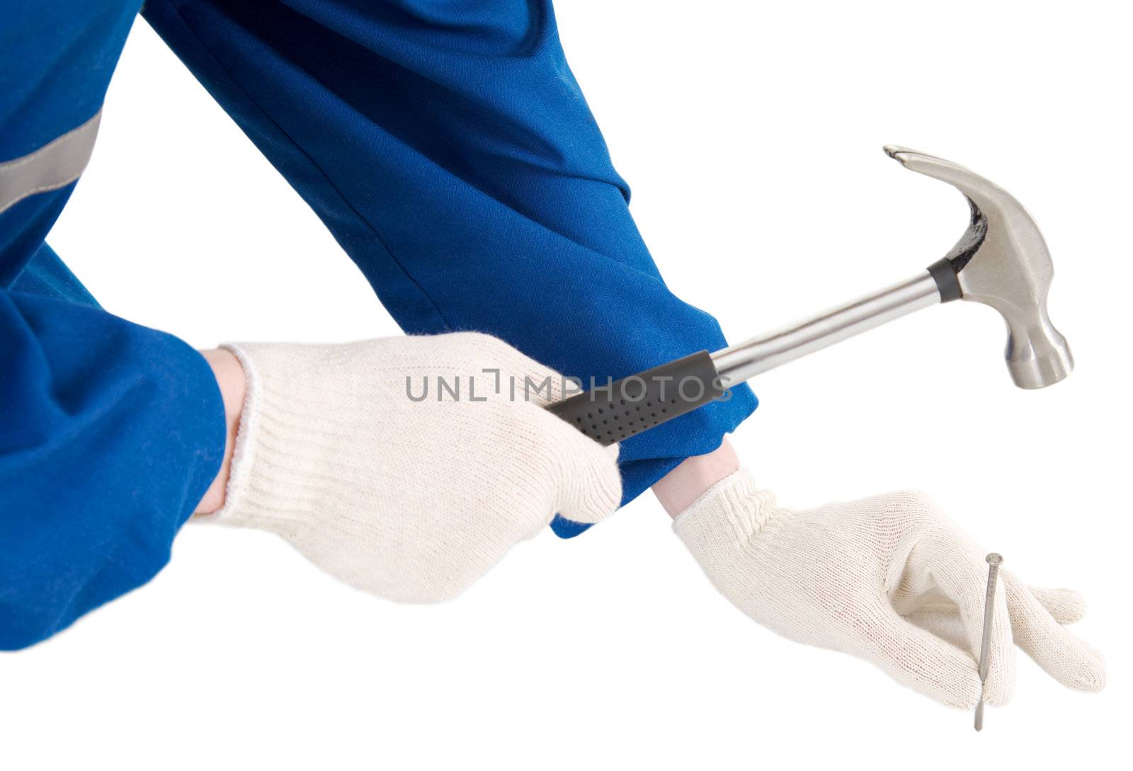 Male hand with hammer and nail on a white background