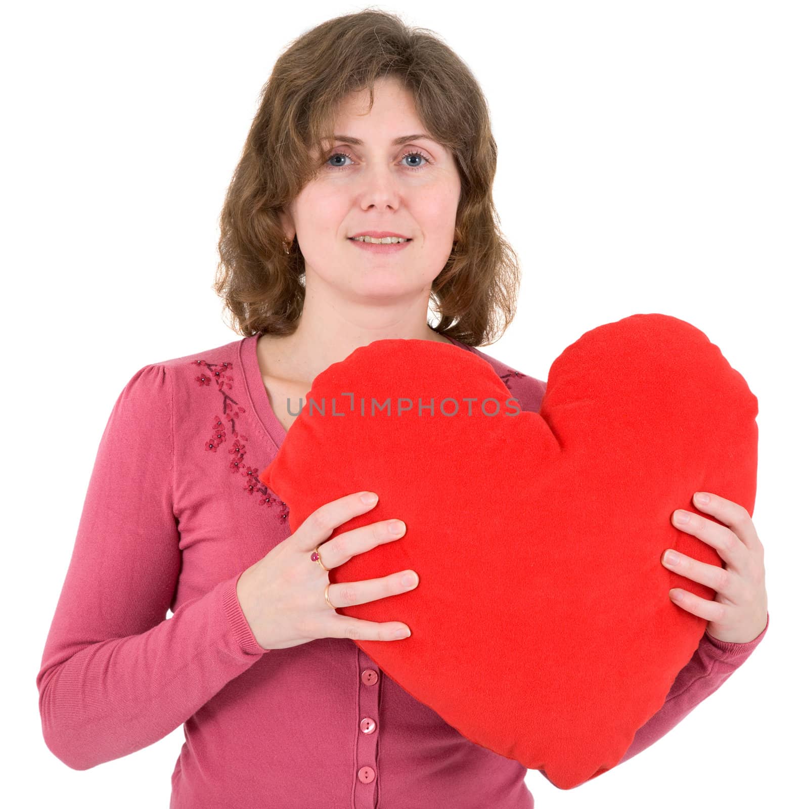 Woman presses red big heart to itself