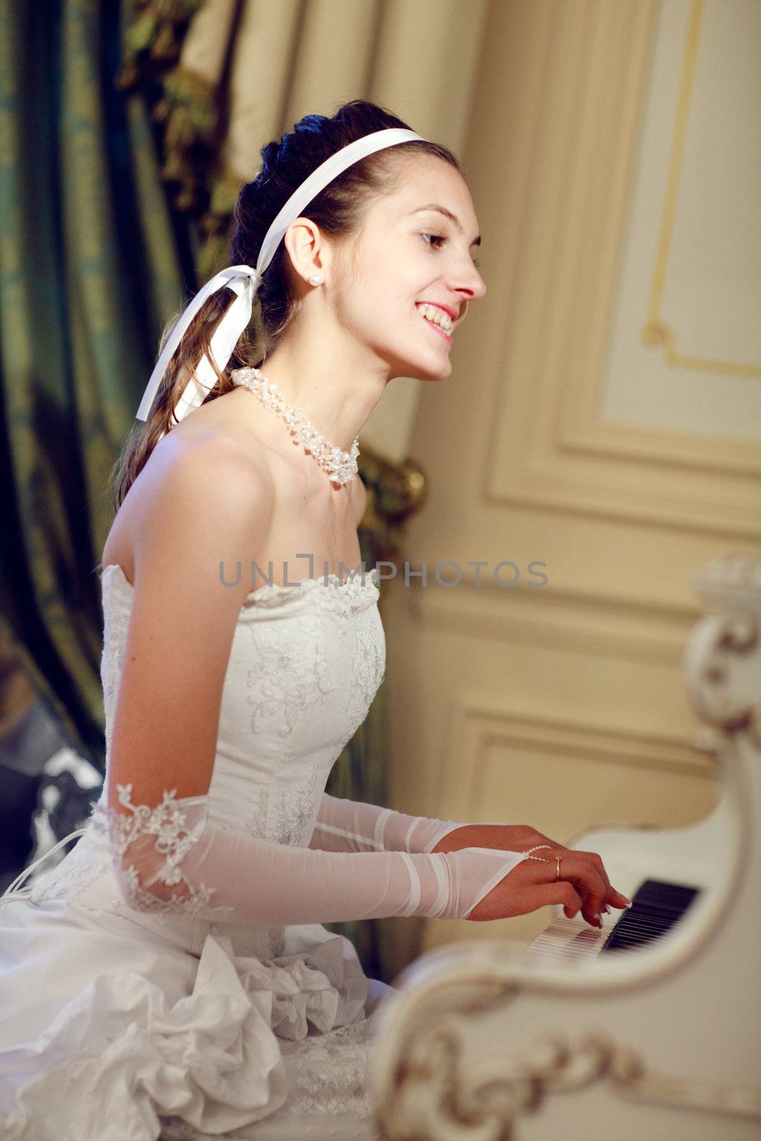 bride playing the grand piano
