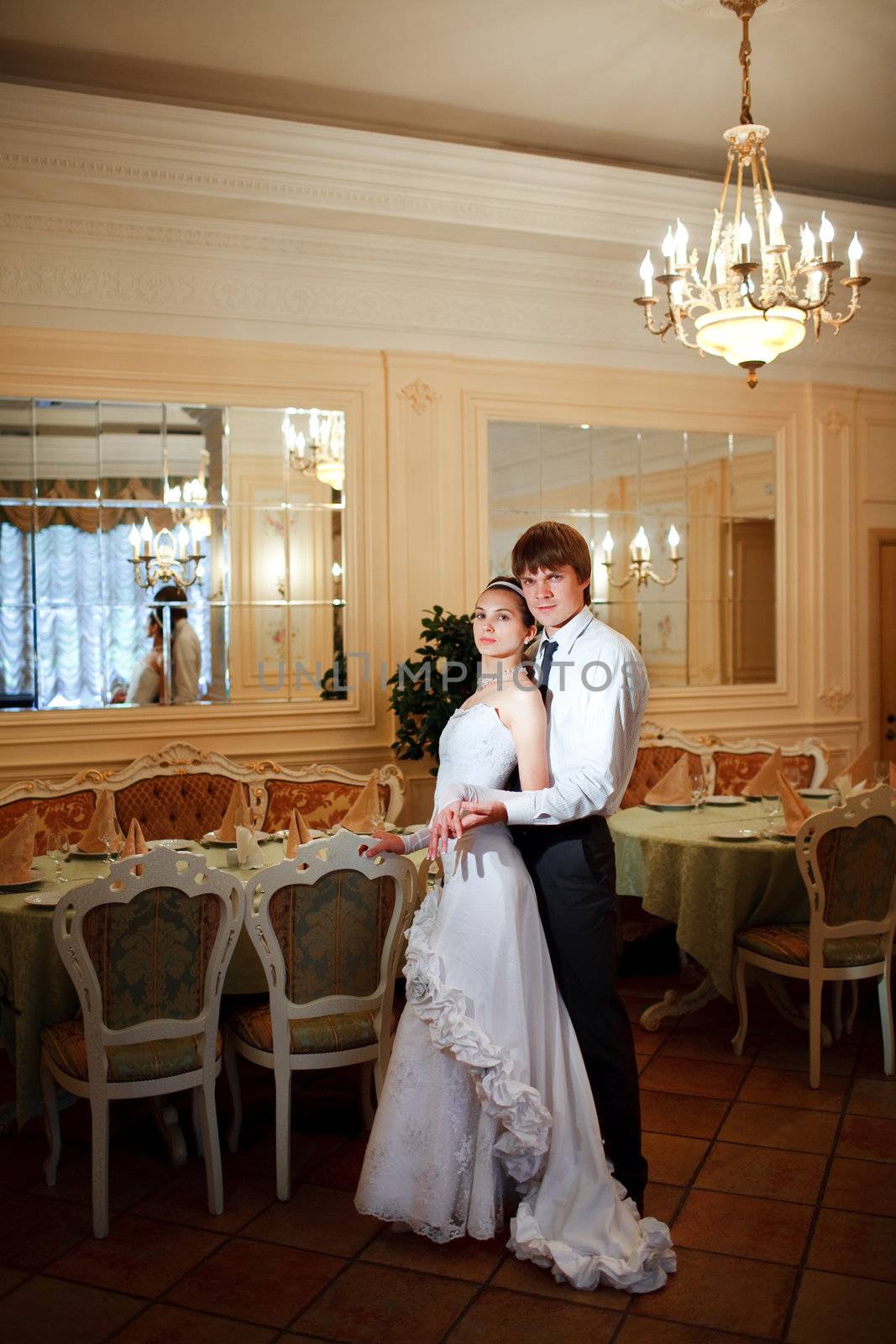 happy bride and groom at the holl