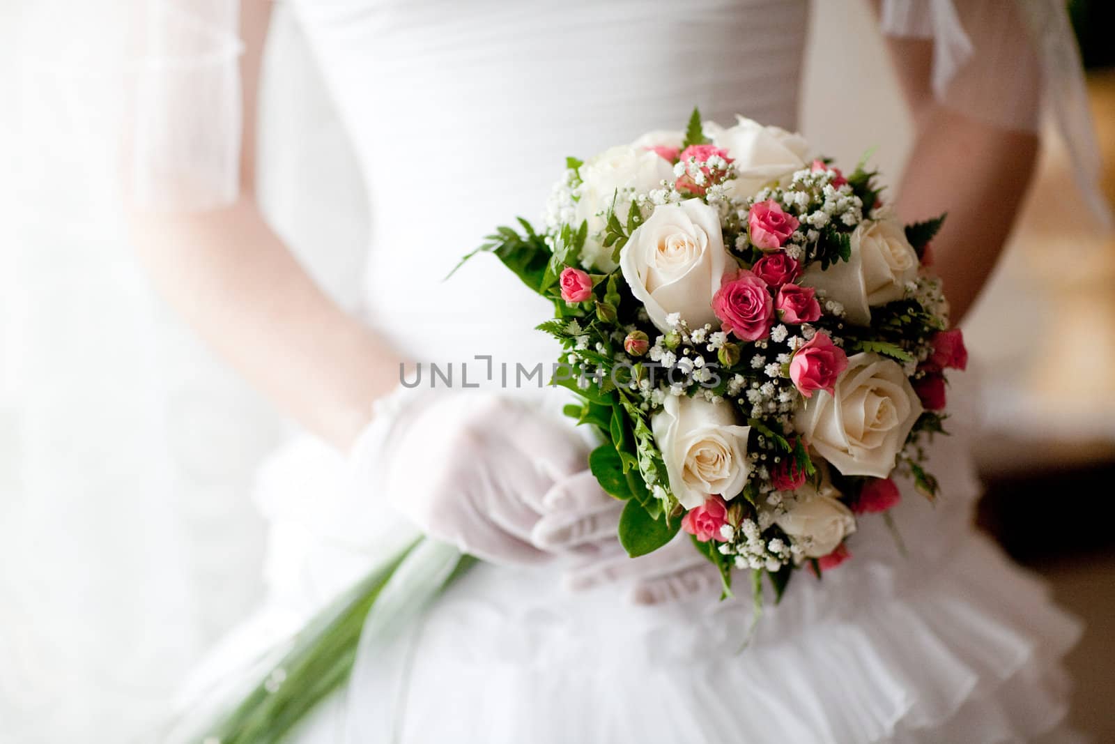 wedding bouquet in hands of the bride