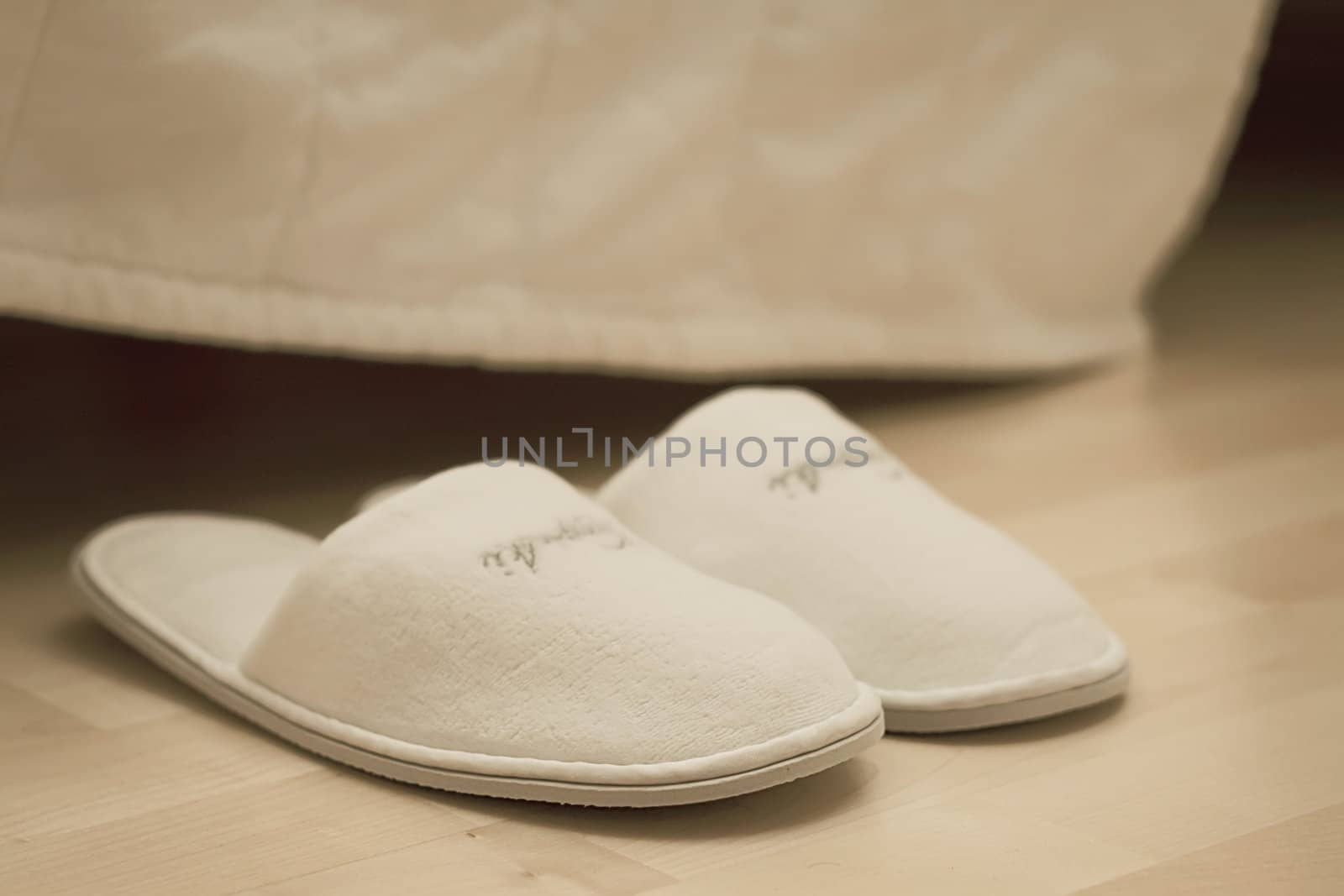 slippers and part of blanket, hospitality concept, shallow DOF