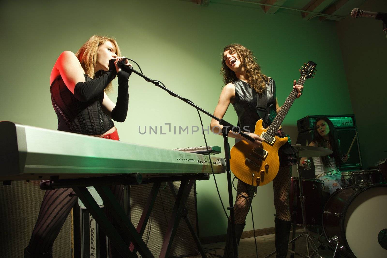 Caucasian girl band playing instruments.