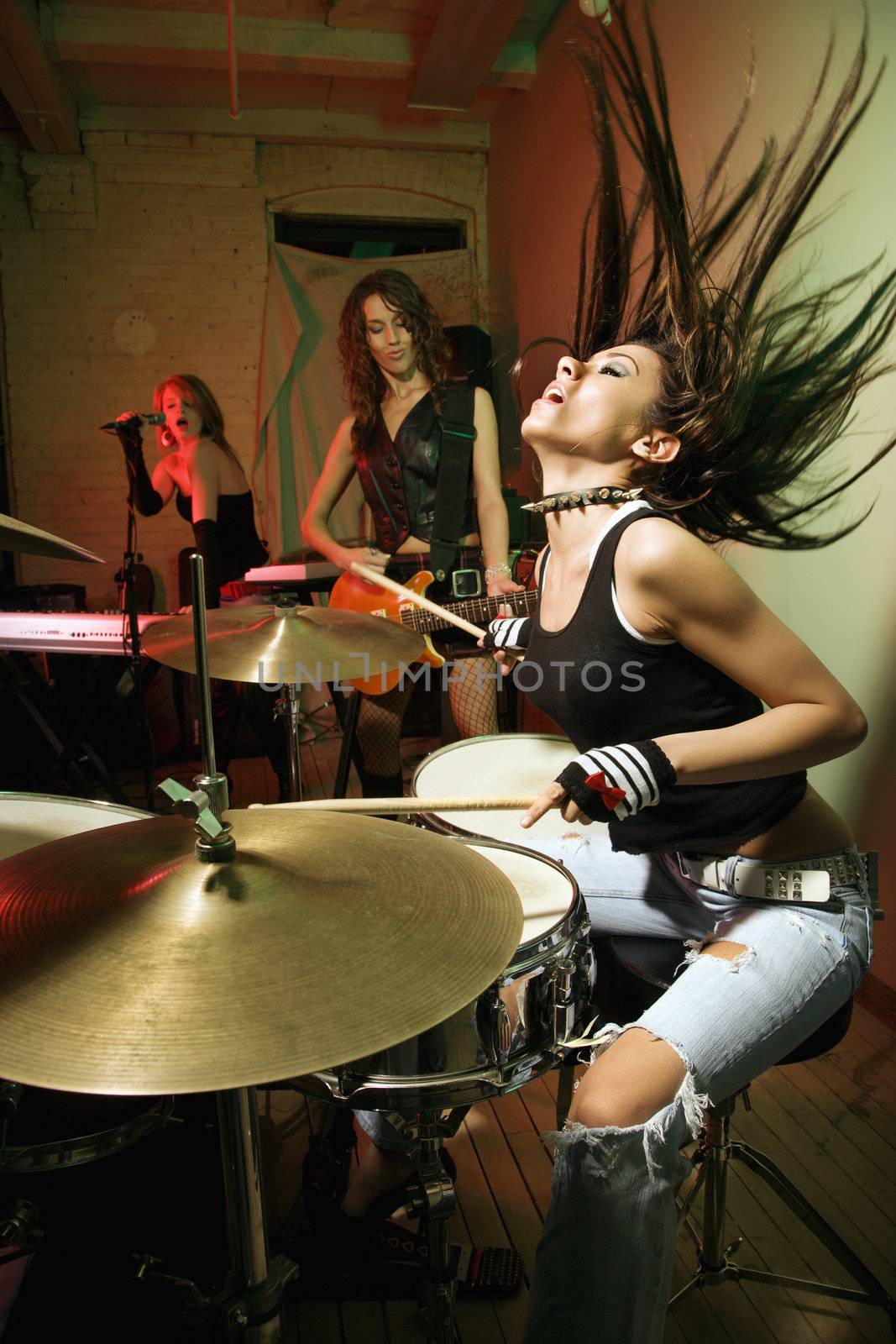 Caucasian girl band playing instruments.