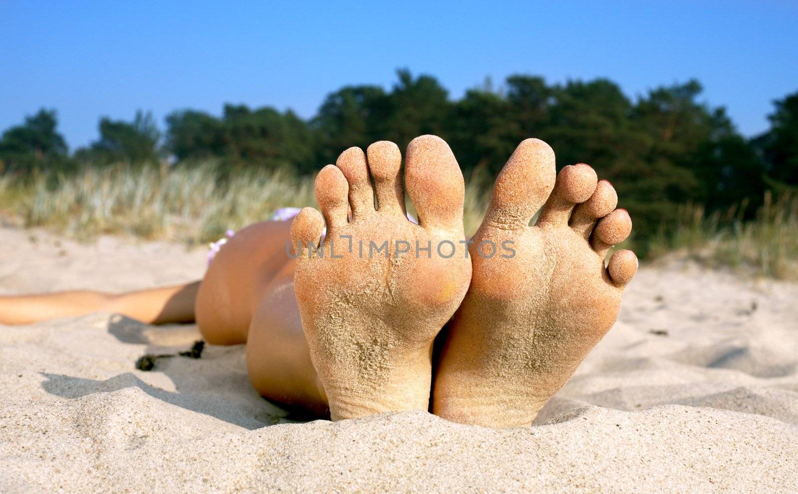 soles and toes of beach girl