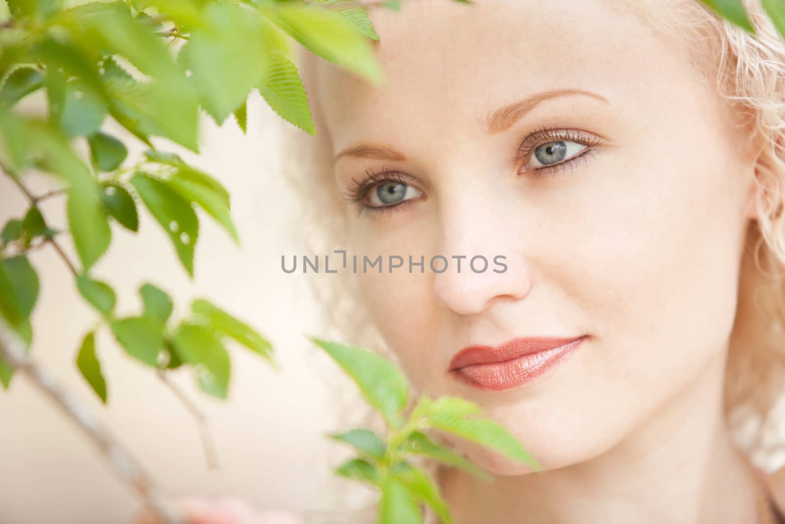 portrait of a girl in green leaves