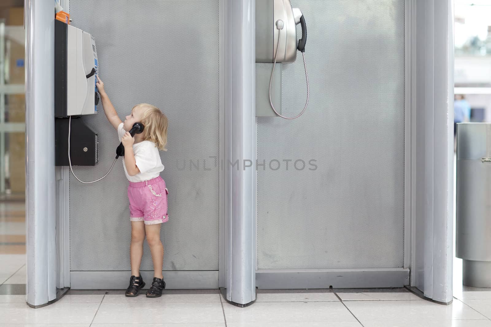 child calling in the airport