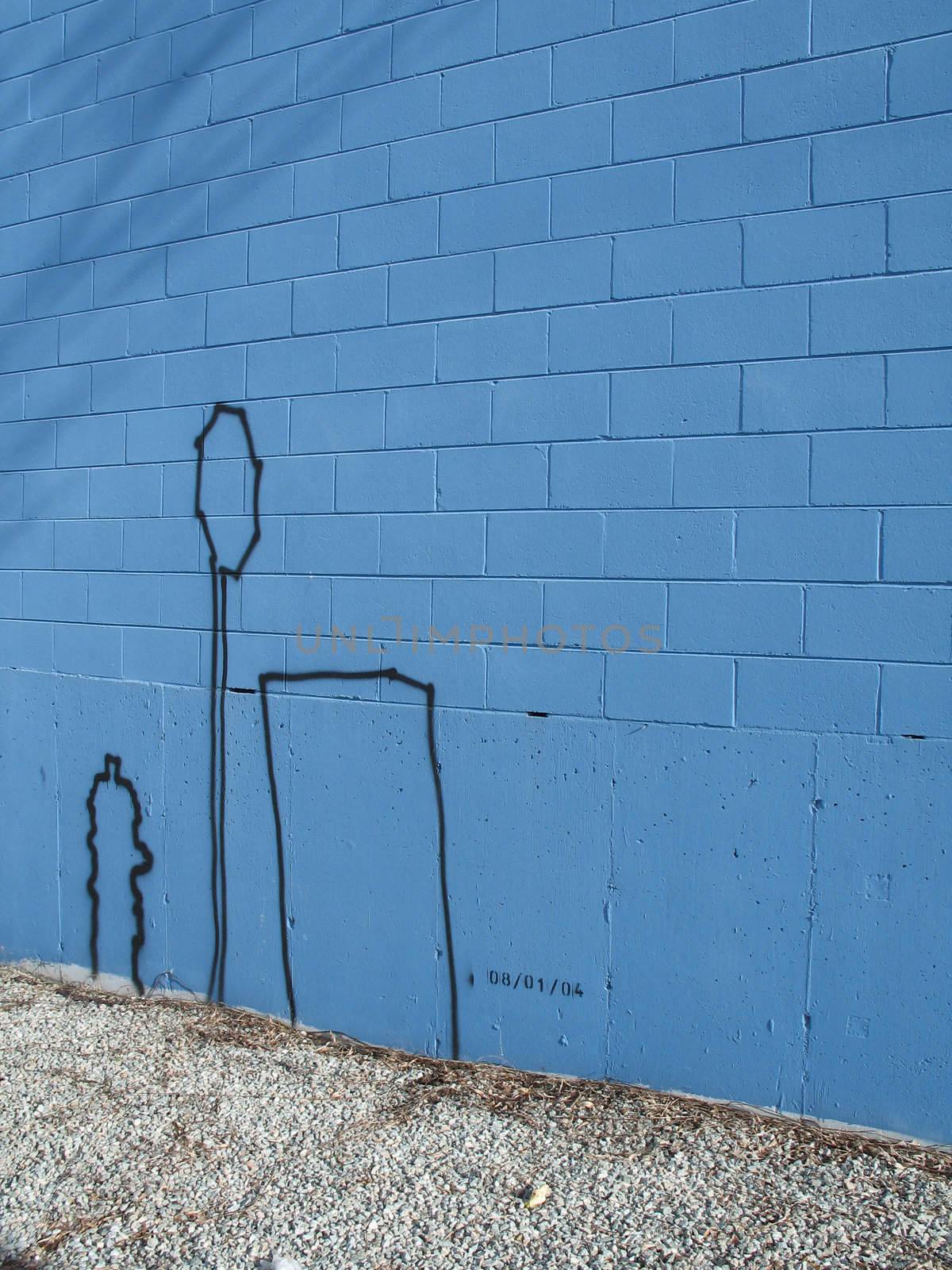 graffiti on a blue wall by mmm
