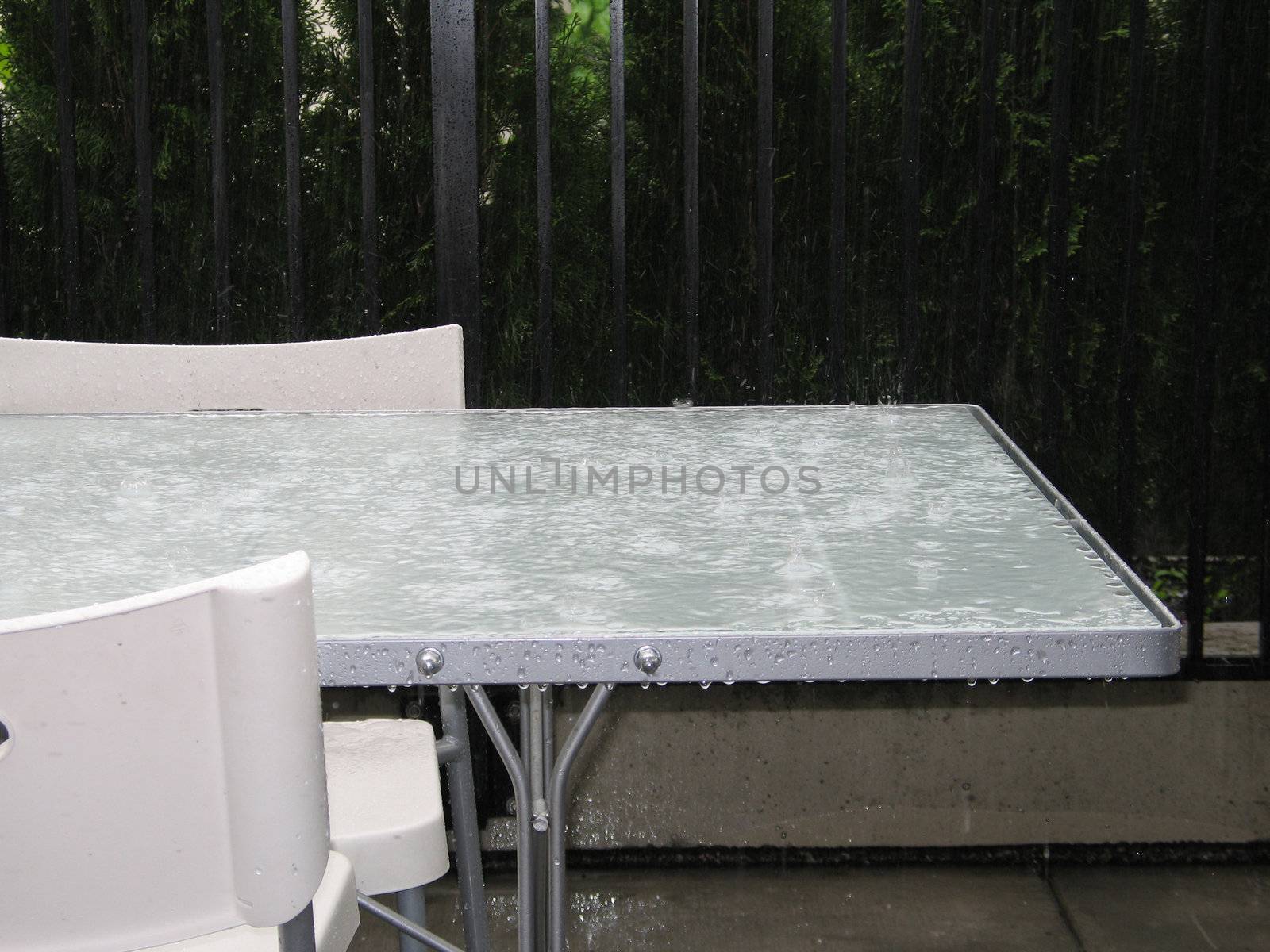 heavy rain on a table by mmm