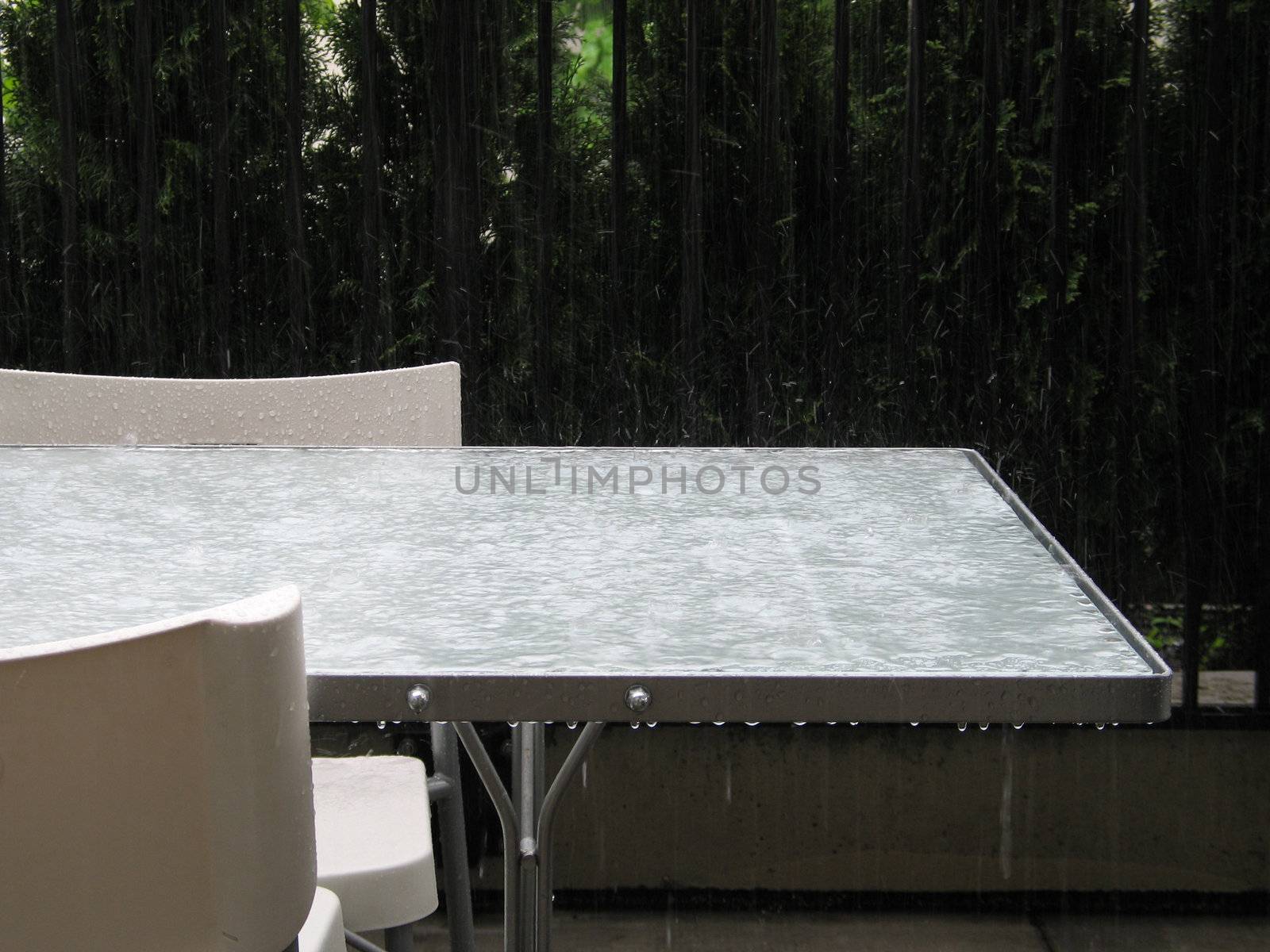 heavy rain on a table by mmm