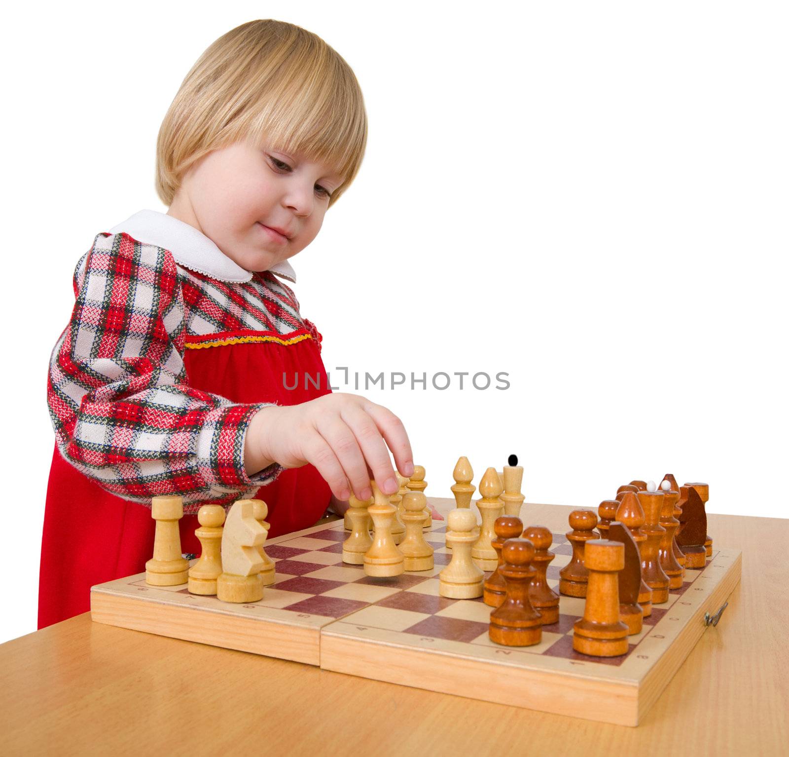 Little girl playing the wooden chess on white