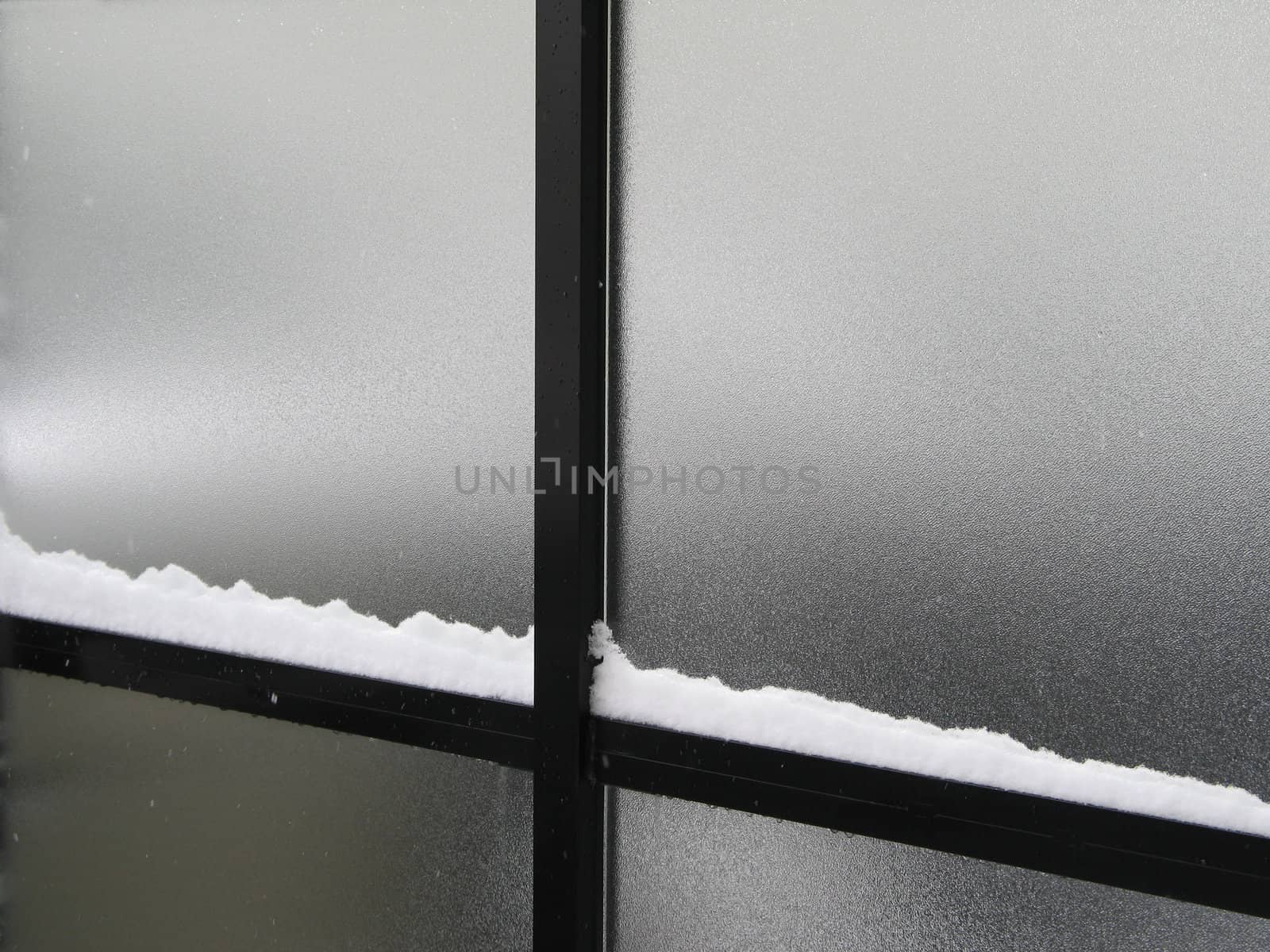 snow on a window frame