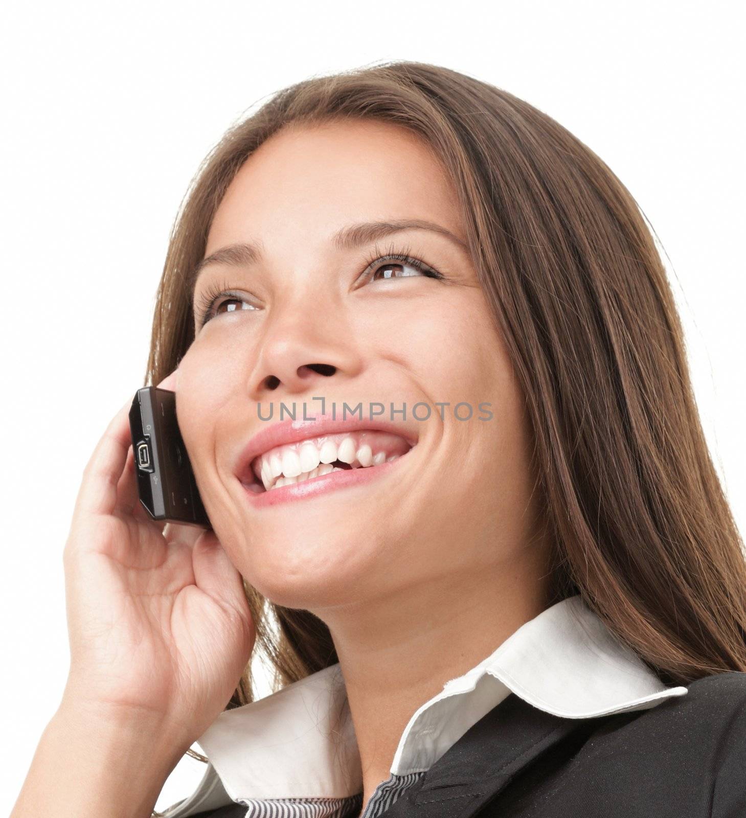 Mobile phone businesswoman. Beautiful business woman talking on cell phone while looking away. Isolated on white background.