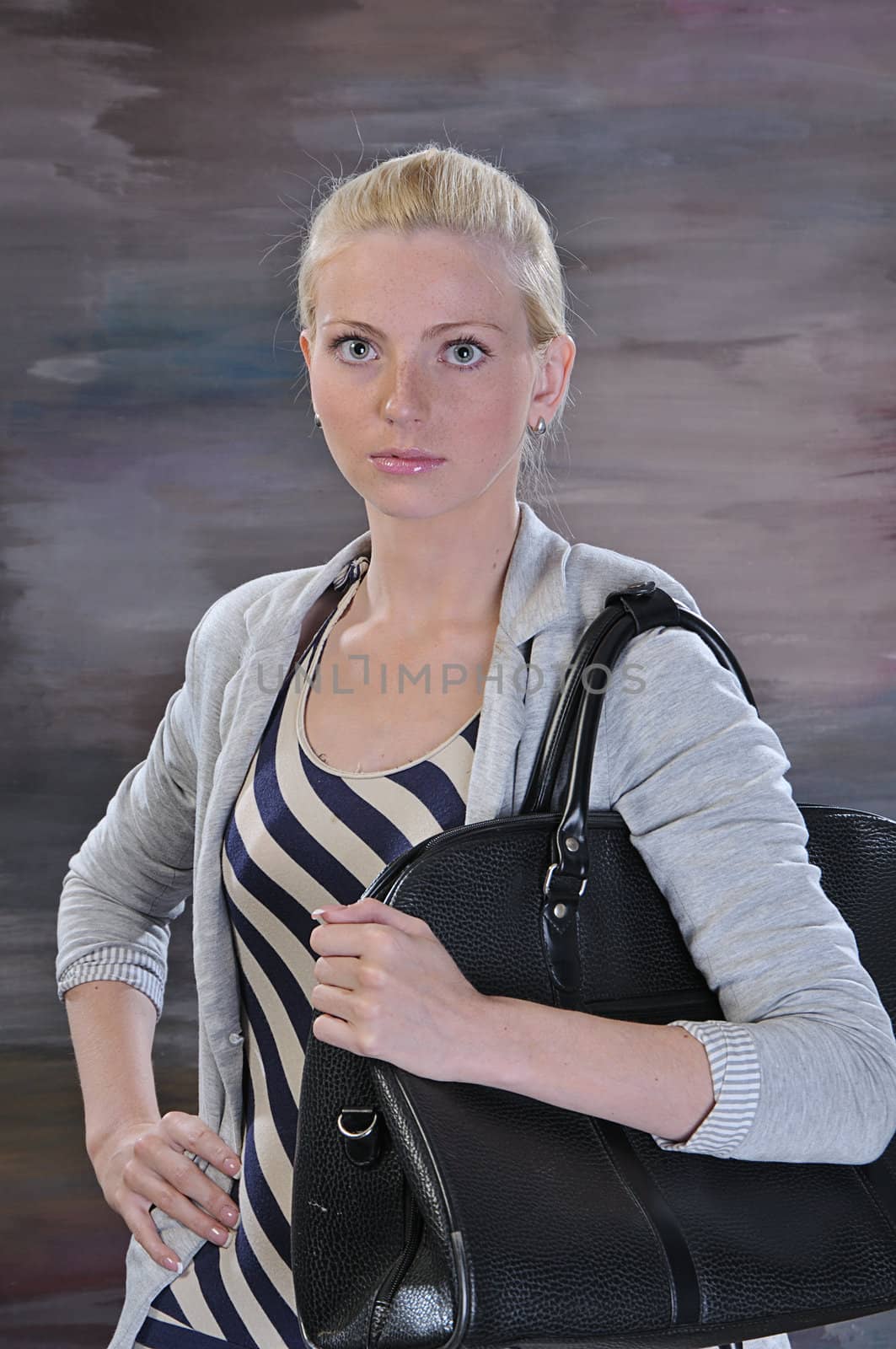 young woman 20-25 years with road bag by dyoma