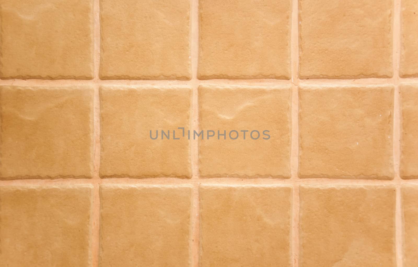 yellow tiled wall of marble as background abstract texture 