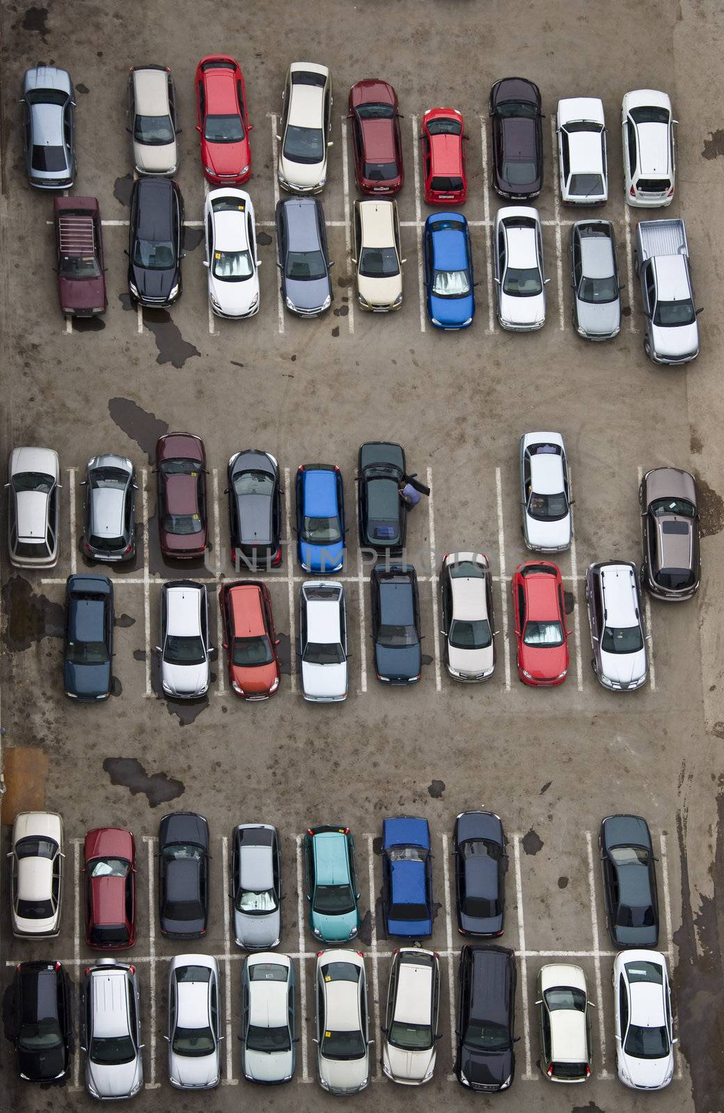 Parking with parked cars. Aerial view from a height.