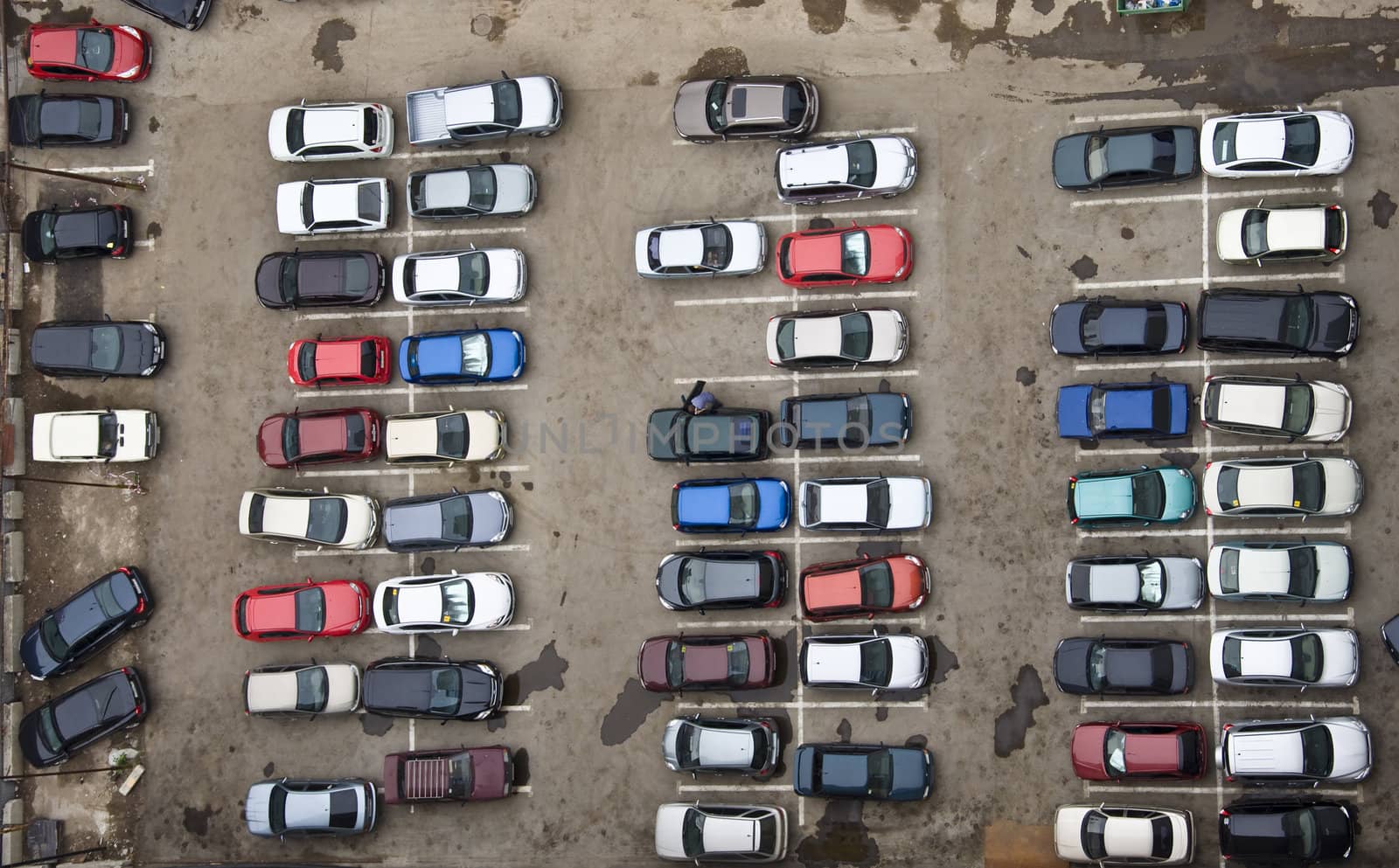 Parking with parked cars. Aerial view from a height.