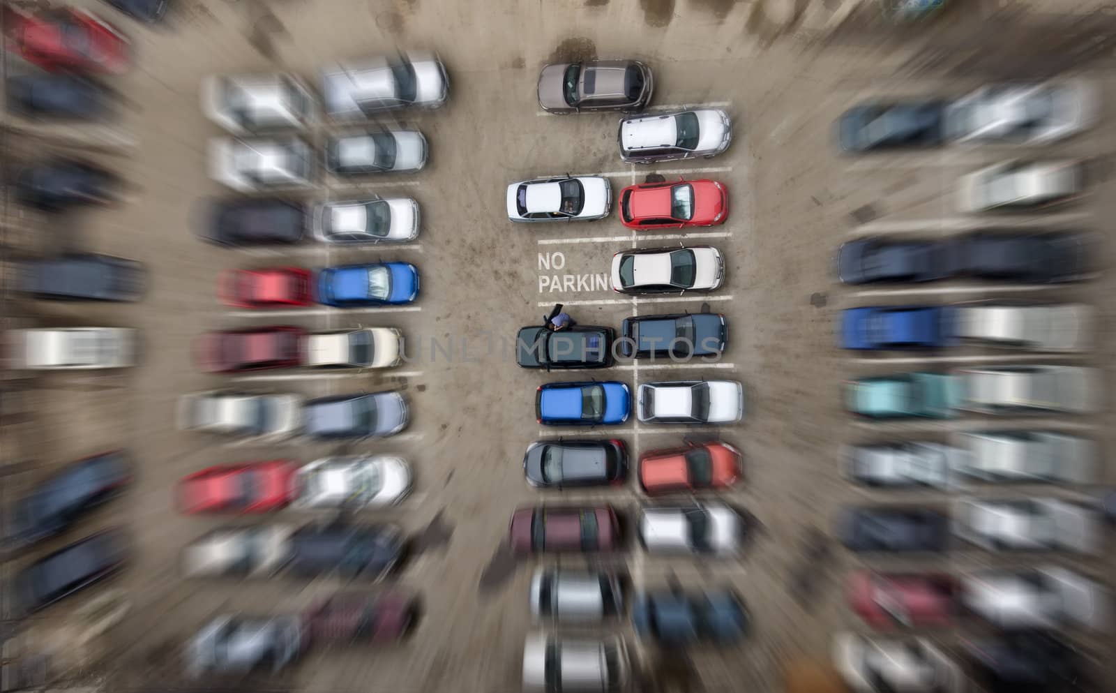 Parking for cars. Falling from height and motion blur. The inscription on the free parking place "no parking".