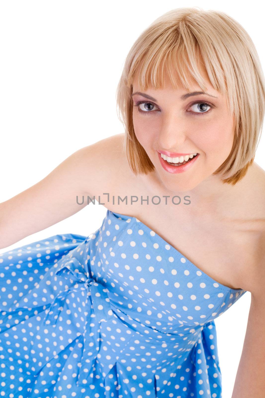 Girl in a blue polka dot dress on isolated white