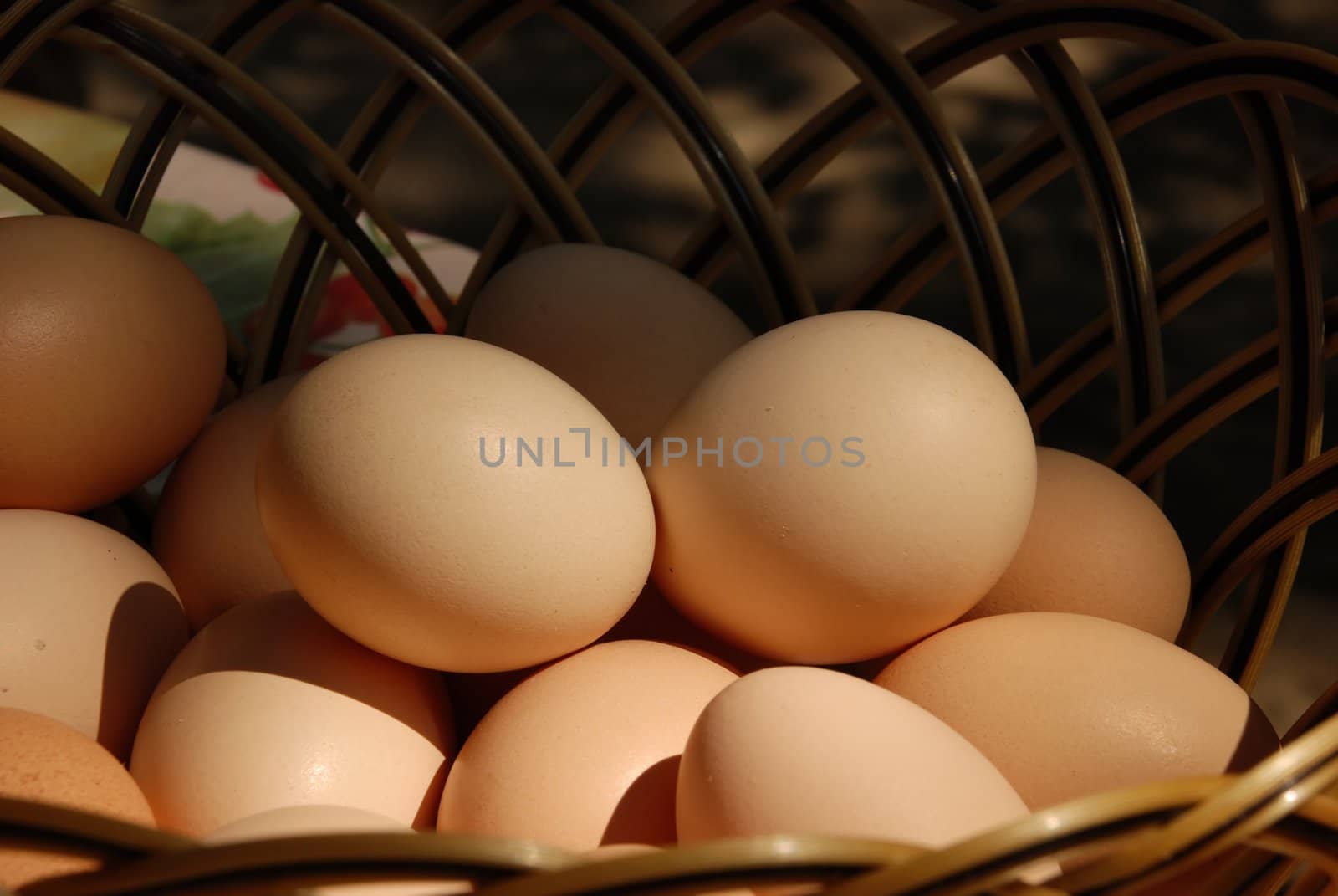 natural organic eggs in basket on table