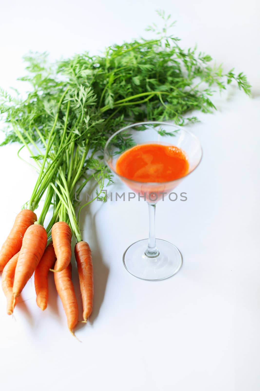 shot of carrots from garden fresh juice by creativestock
