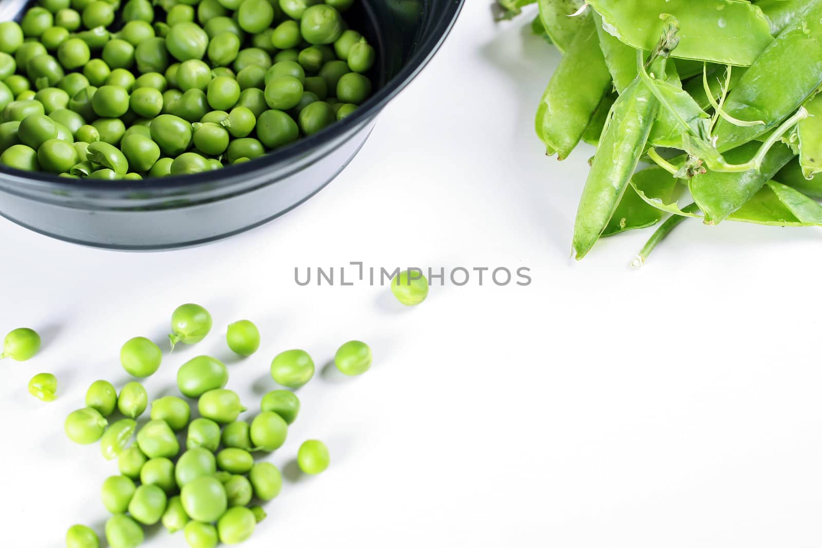 shot of fresh shelled peas upclose by creativestock