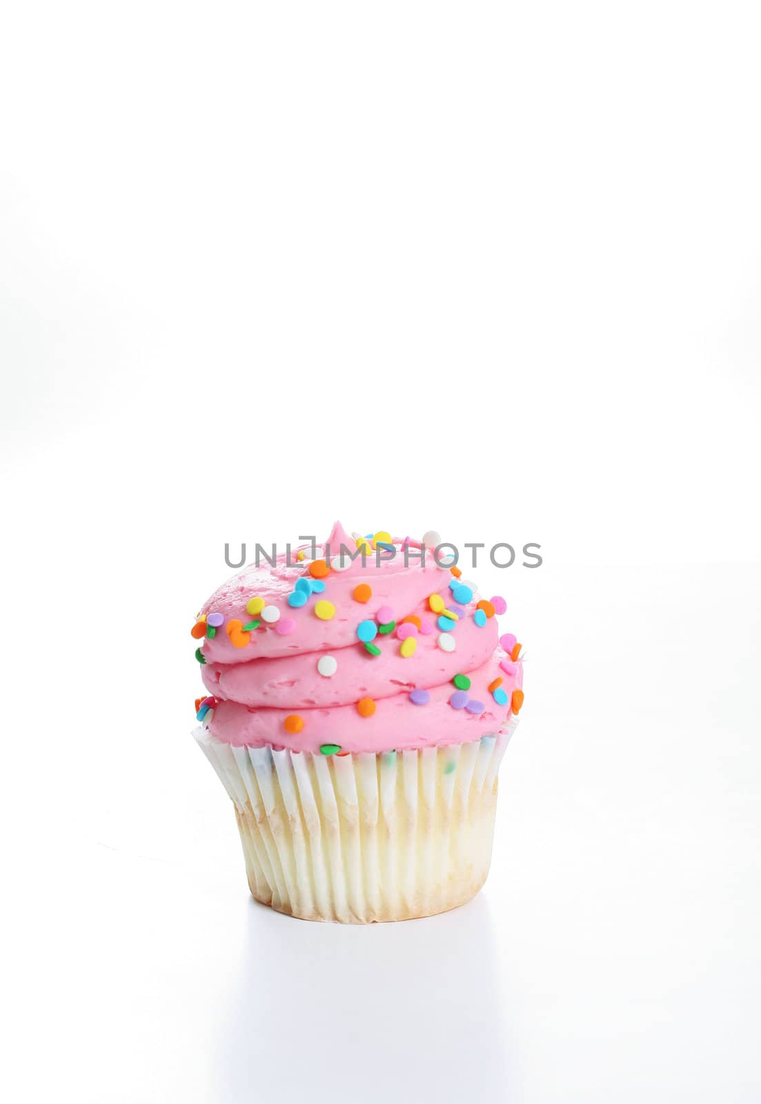 shot of a big frosting cupcake vertical by creativestock