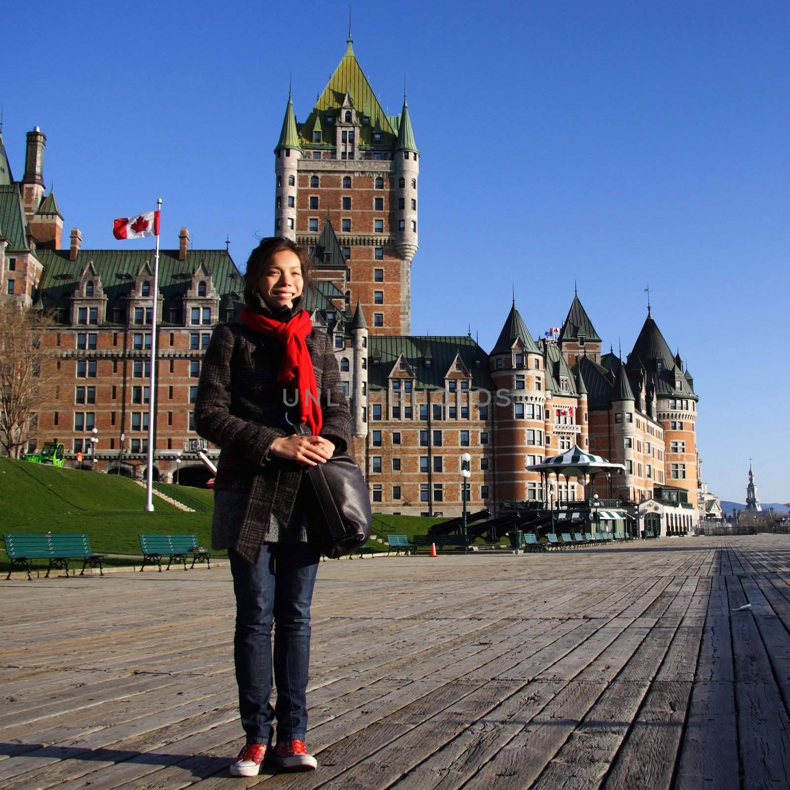 Tourist on Terrasse Dufferin in front of Chateau Frontenac - The most famous landmark in Quebec City.