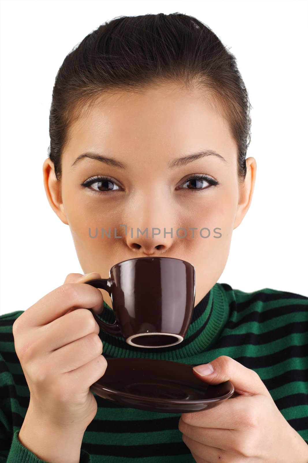 Beautiful young woman drinking espresso