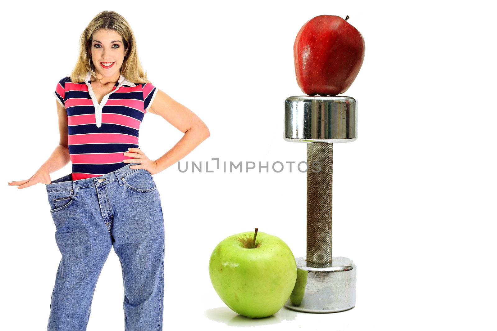 shot of weightloss workout apples in jeans by creativestock