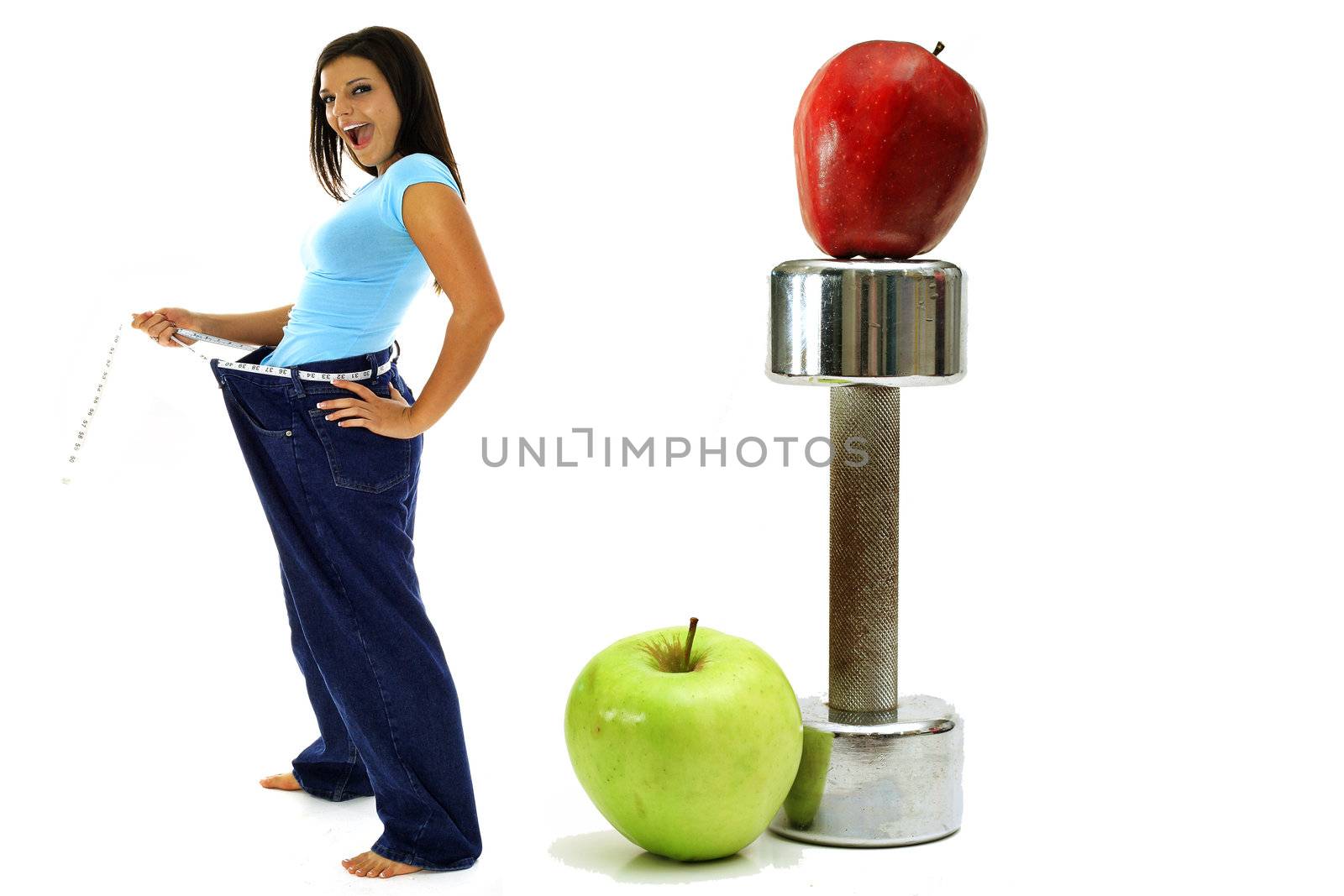 shot of weight loss workout apples brunette in jeans by creativestock