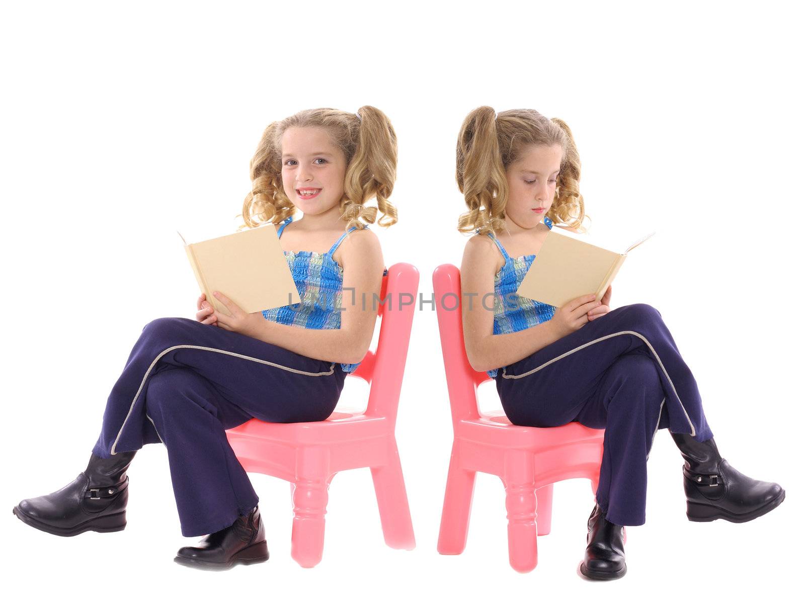 twins reading isolated on white by creativestock