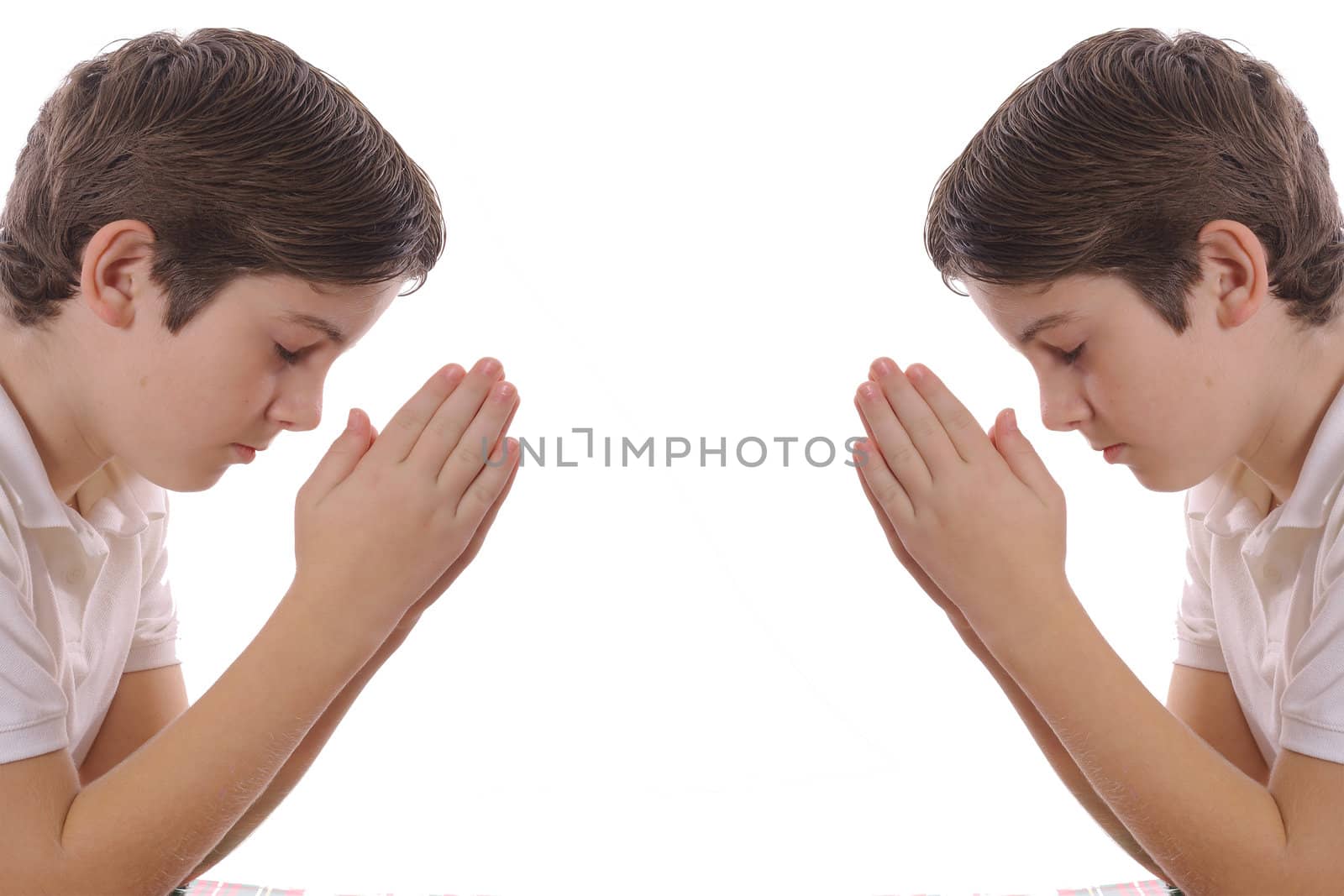 Twin brothers praying isolated on white by creativestock