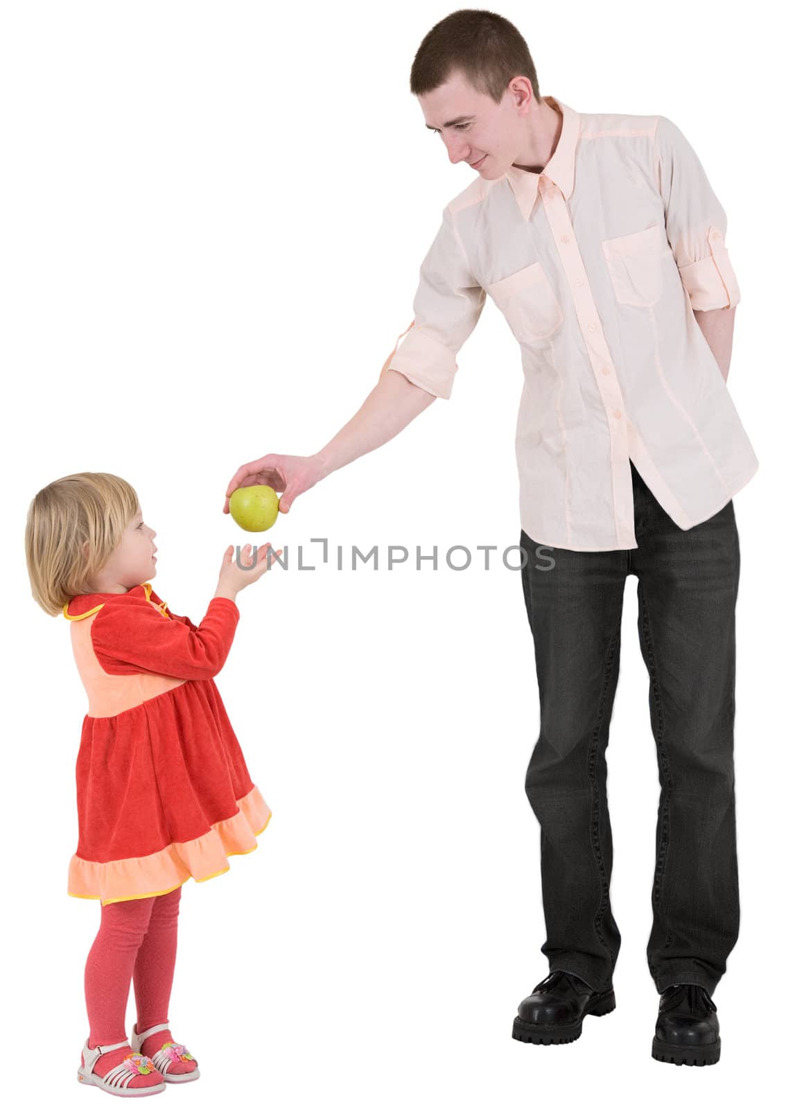 Little girl asks apple beside young man