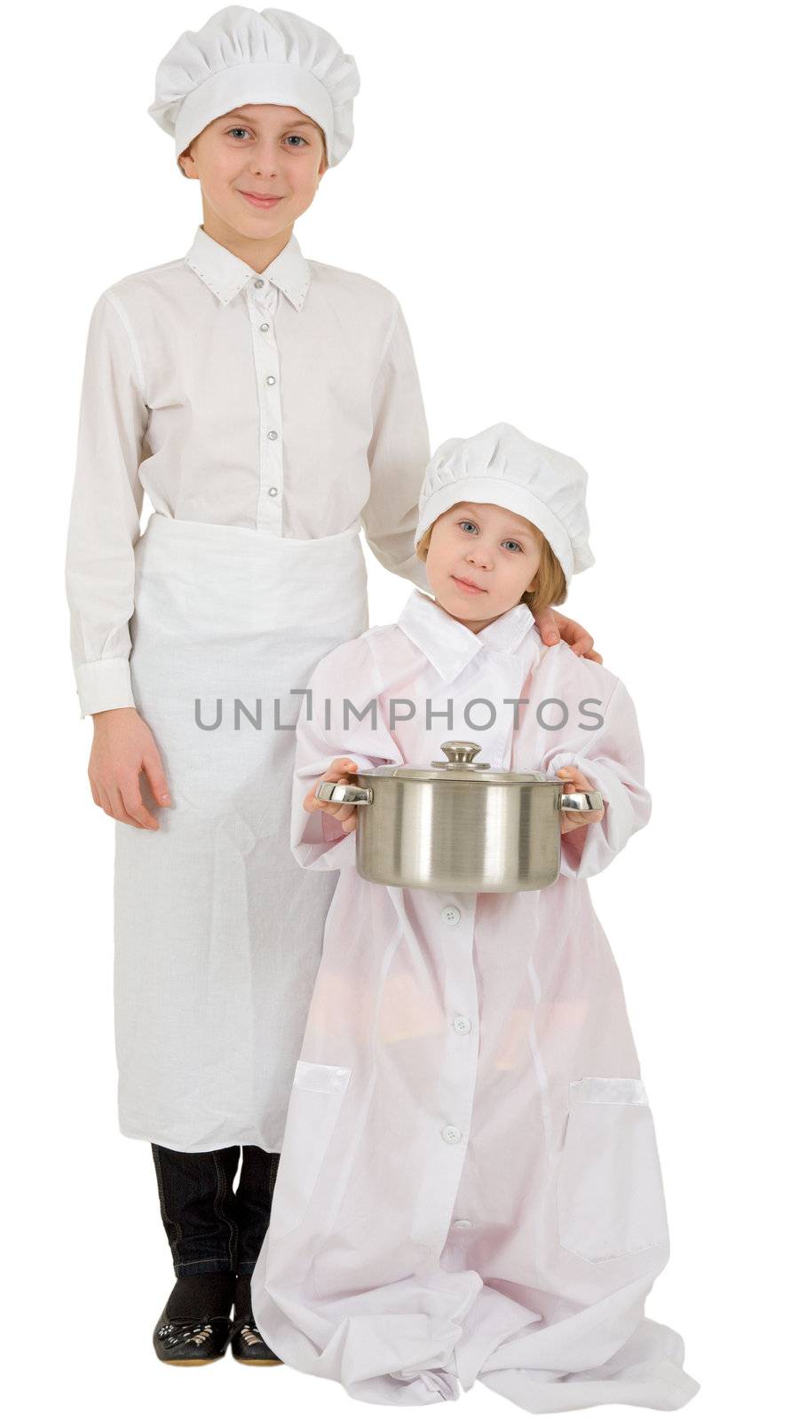 Two girls in garb of the cook on the white background