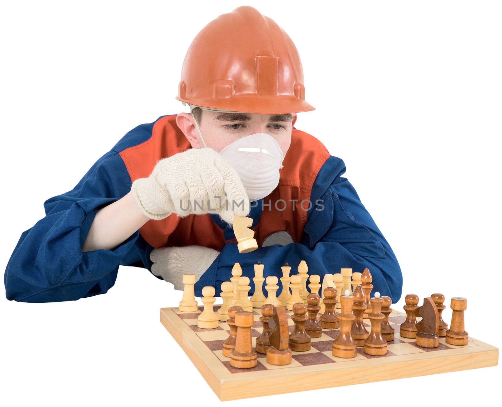 Young man in cloth worker game of chess