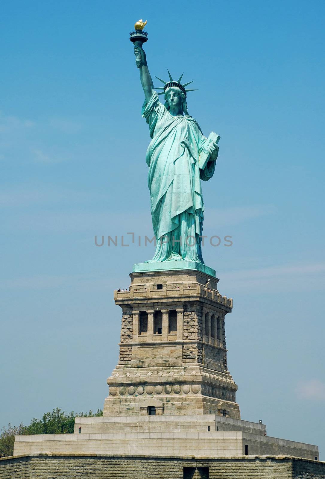 Statue of Liberty fragment over blue sky