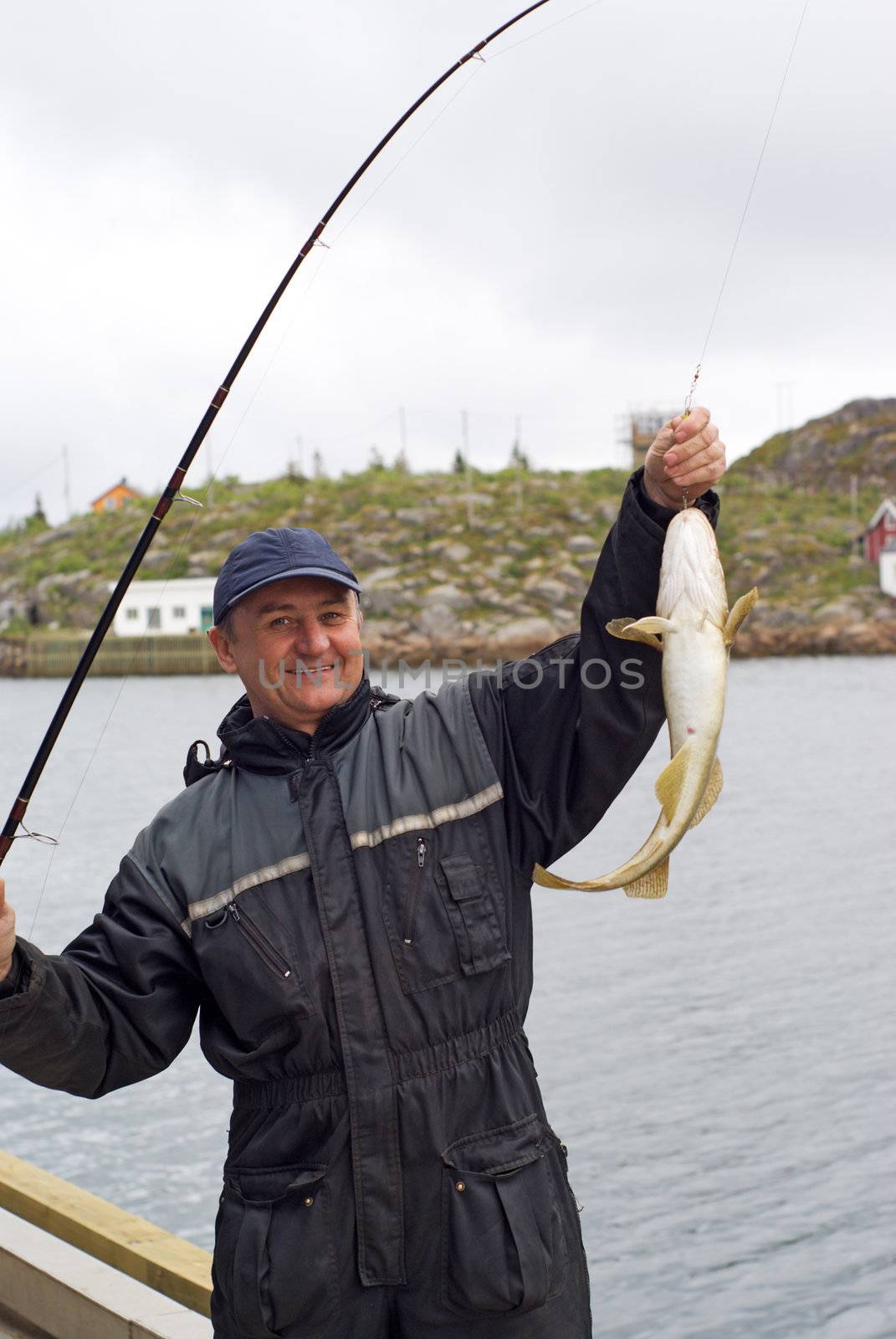 Fisherman on the pier on island Skrova by BIG_TAU