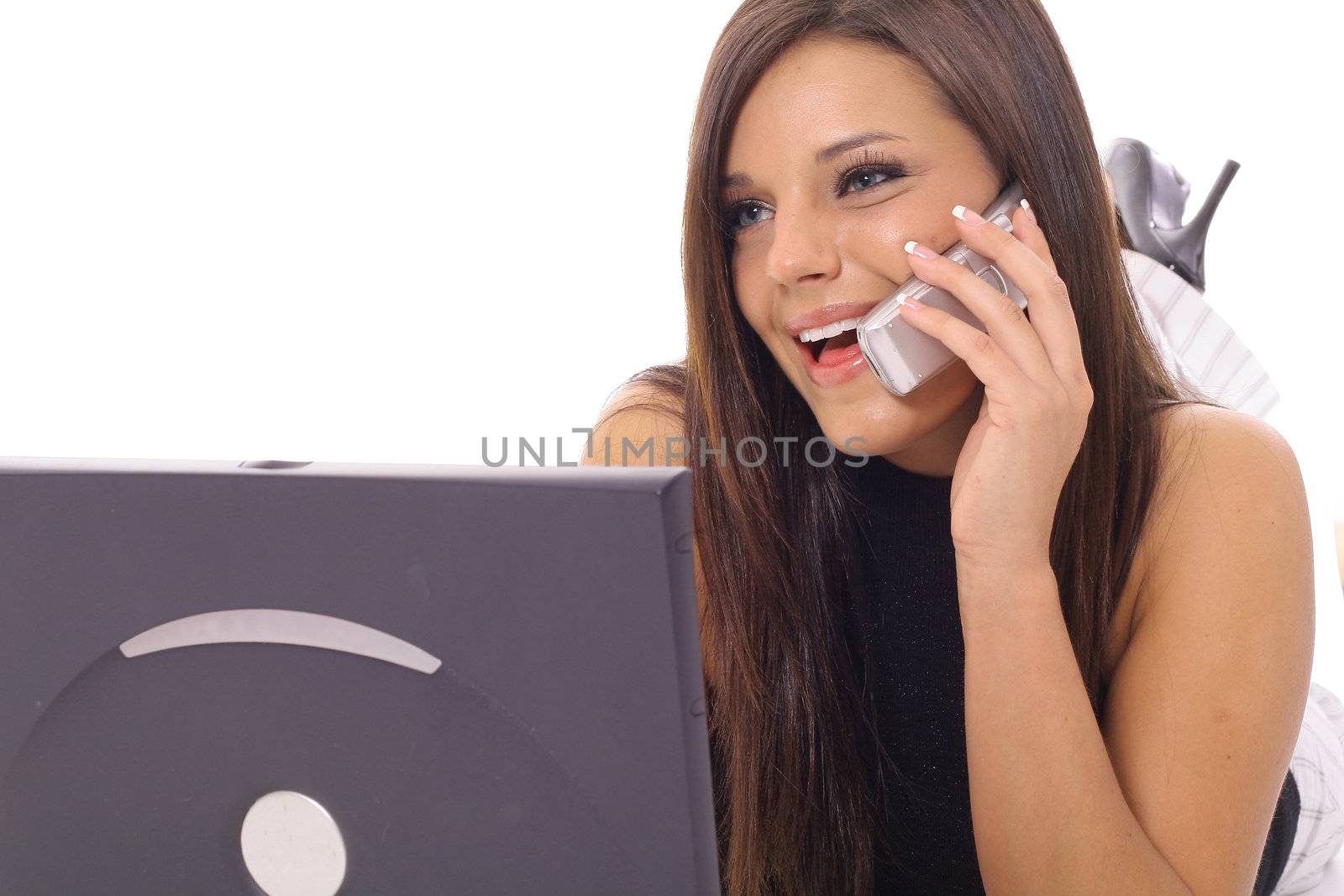 Model talking on the phone checking email upclose  by creativestock