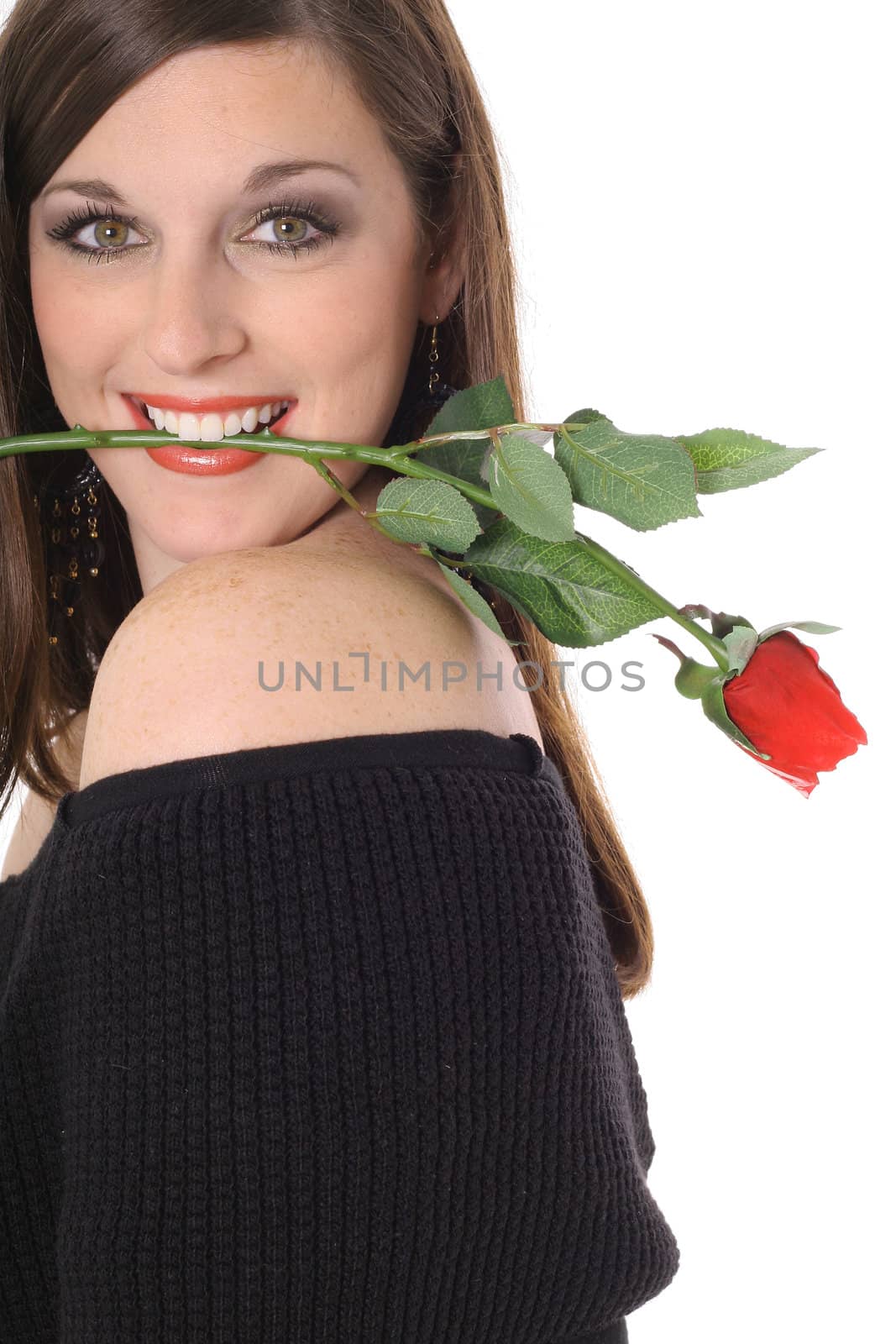 beautiful brunette with a rose in her mouth