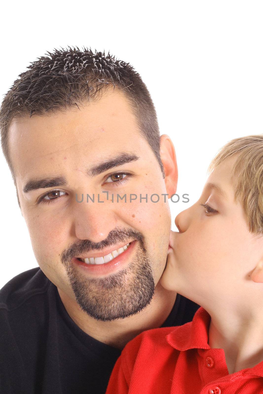 little boy kissing father