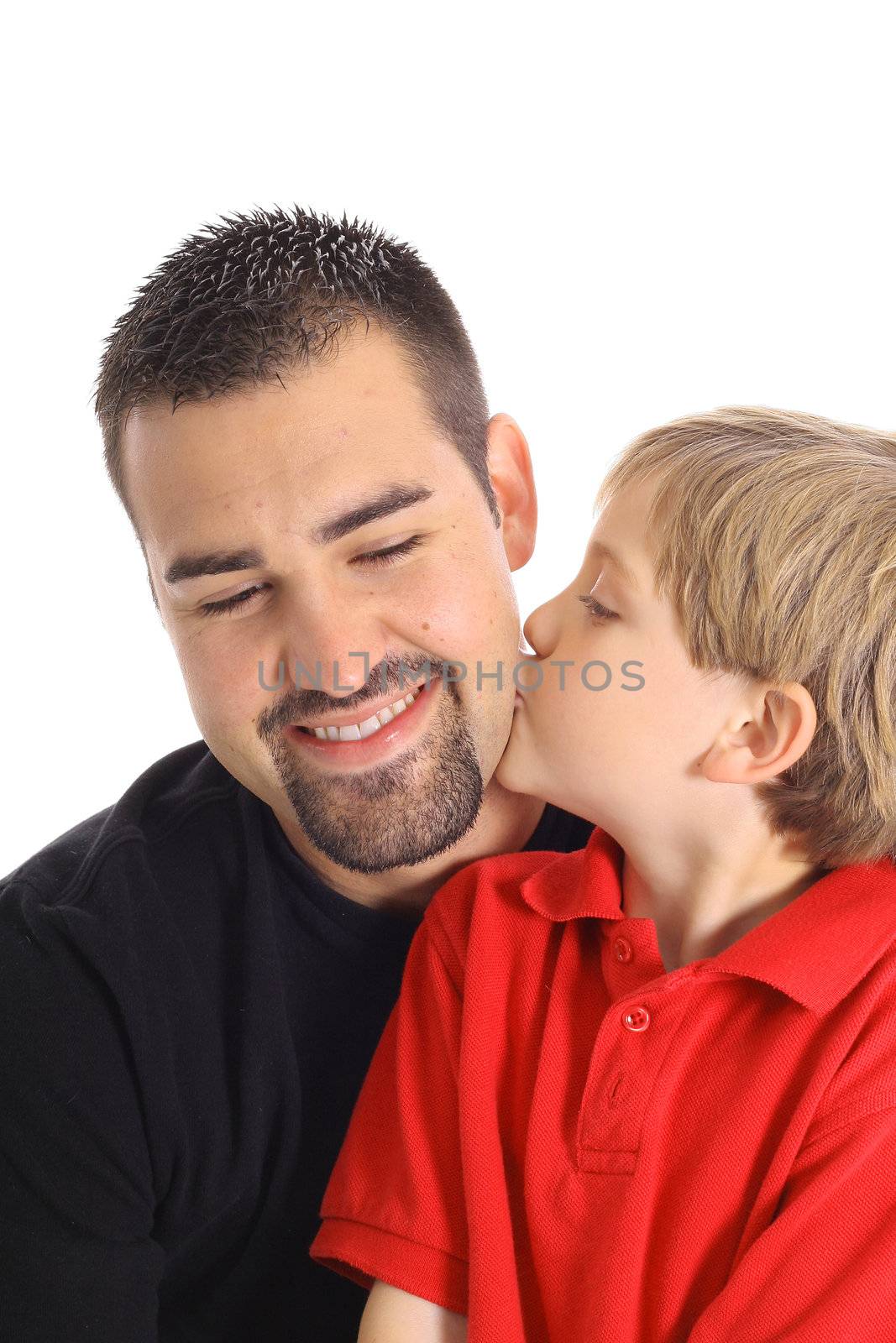 child kissing father isolated on white