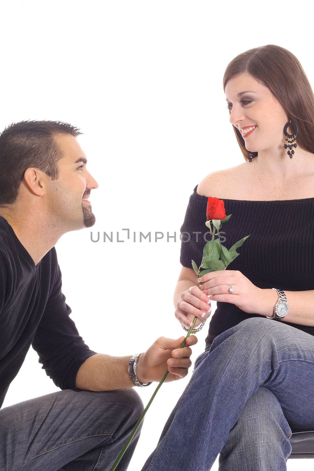 man giving woman a rose isolated on white by creativestock