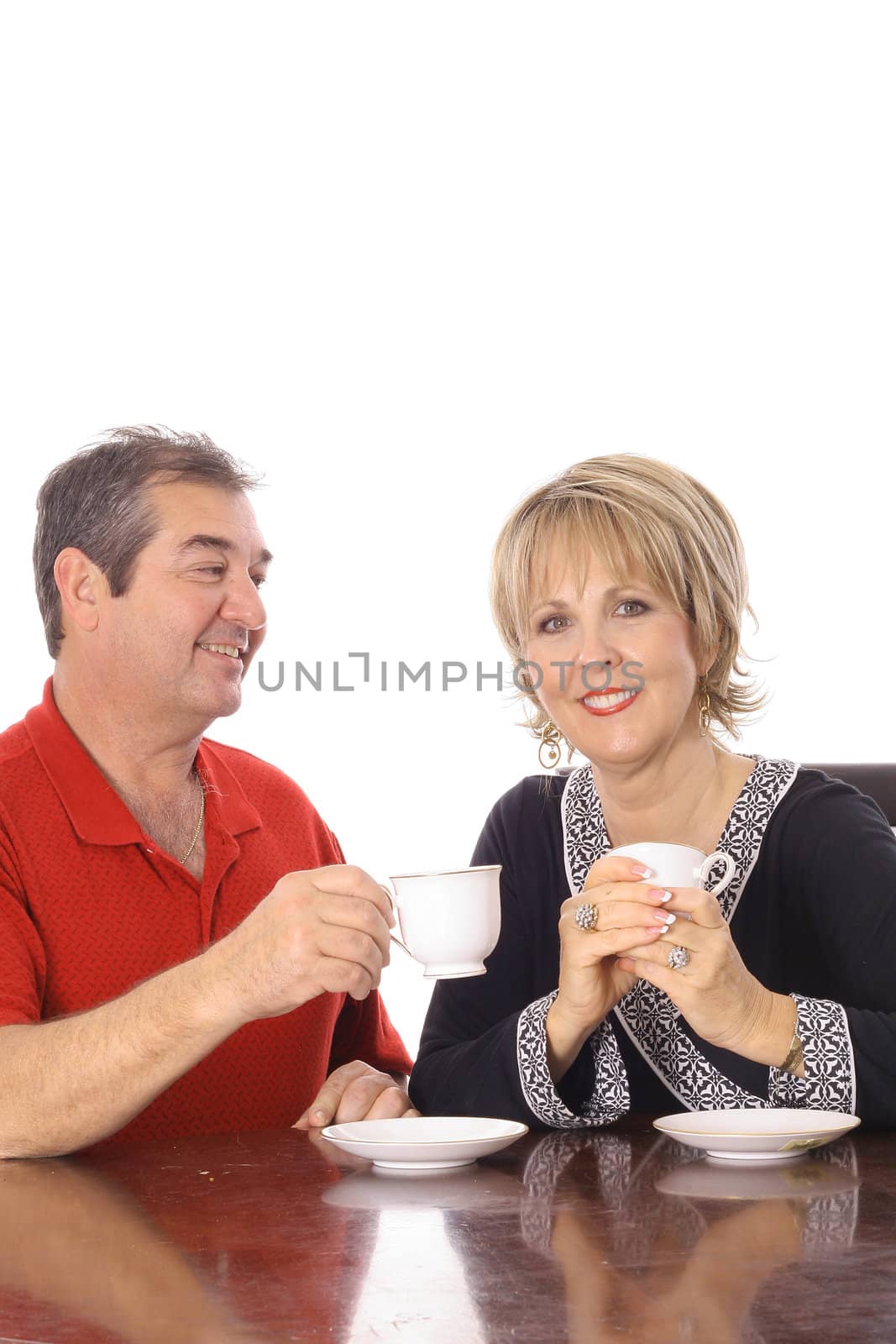 attractive couple having coffee isolated on white by creativestock