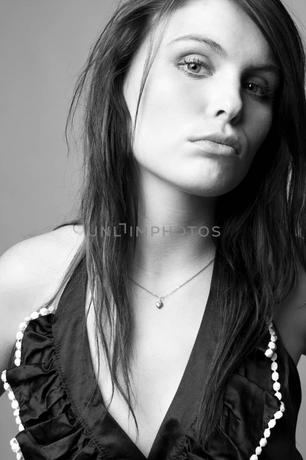 Portrait of young beautiful woman in black and white